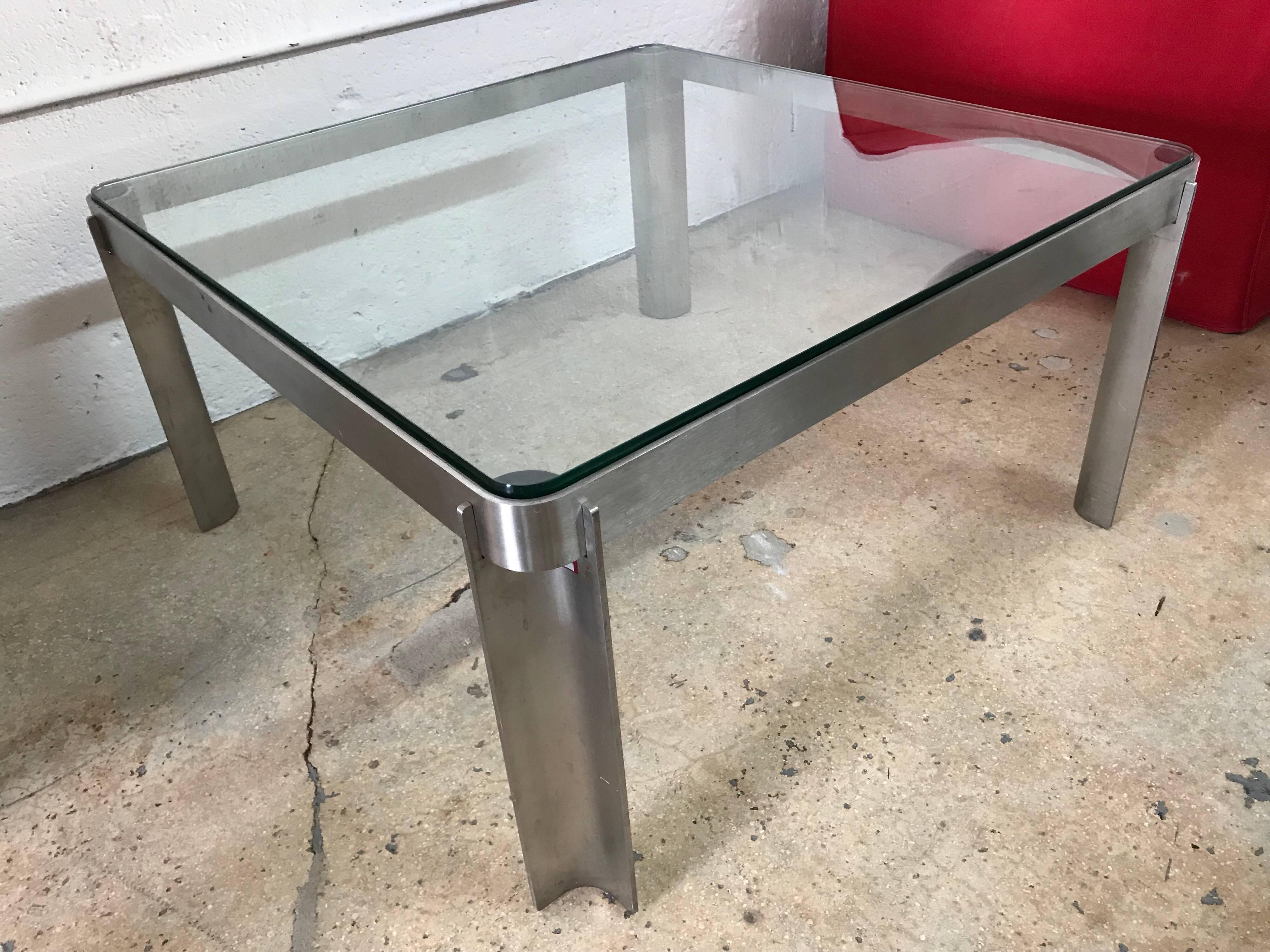 Postmodern coffee or cocktail table rendered in a simple steel frame with a glass top, Italy, circa 1980s.