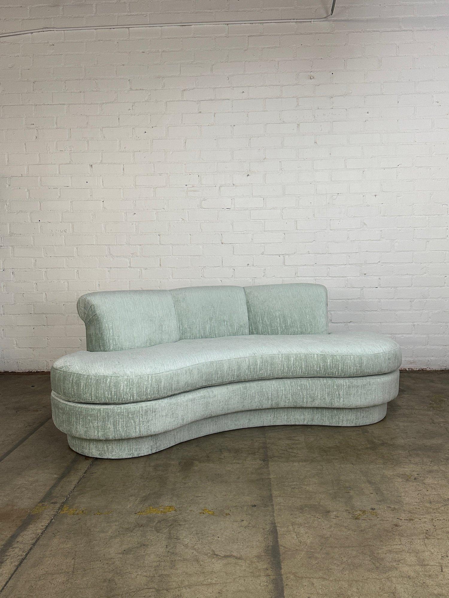 W85 D38 H31 SH20 SW82.5 SD26 SH20

Post Modern Kidney Sofa with fresh foam and fresh textured chenille fabric. Item has two custom ball pillows in velvet. Item shows in excellent fully restored condtion with no areas of visible wear. 