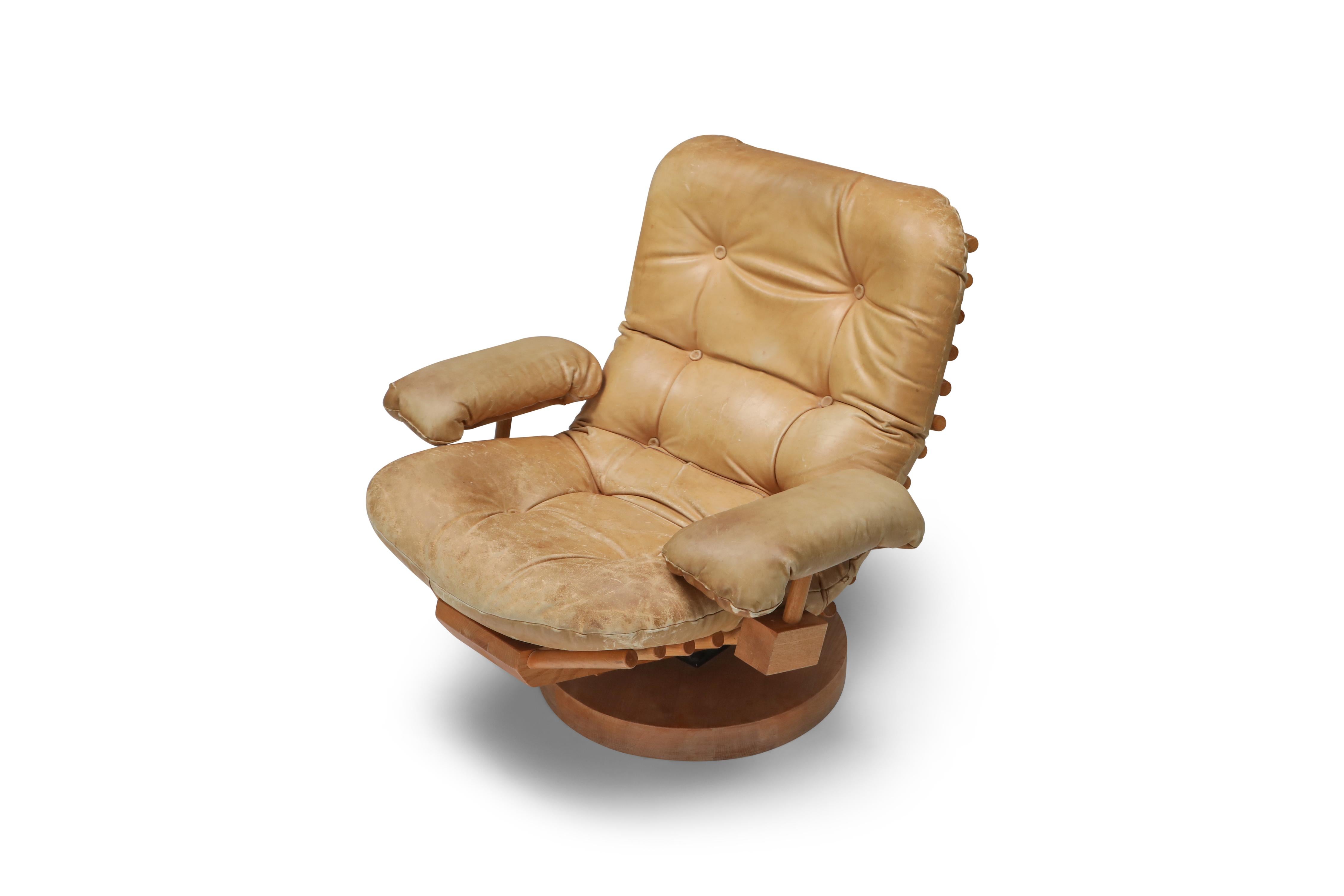 Camel leather and solid elm lounge chair by Blaha, the Netherlands, 1960s.
The solid wooden structure runs like a spine from top to bottom of this amazing lounge chair. Gorgeous camel leather
The piece has a very natural wabi wabi feel, and