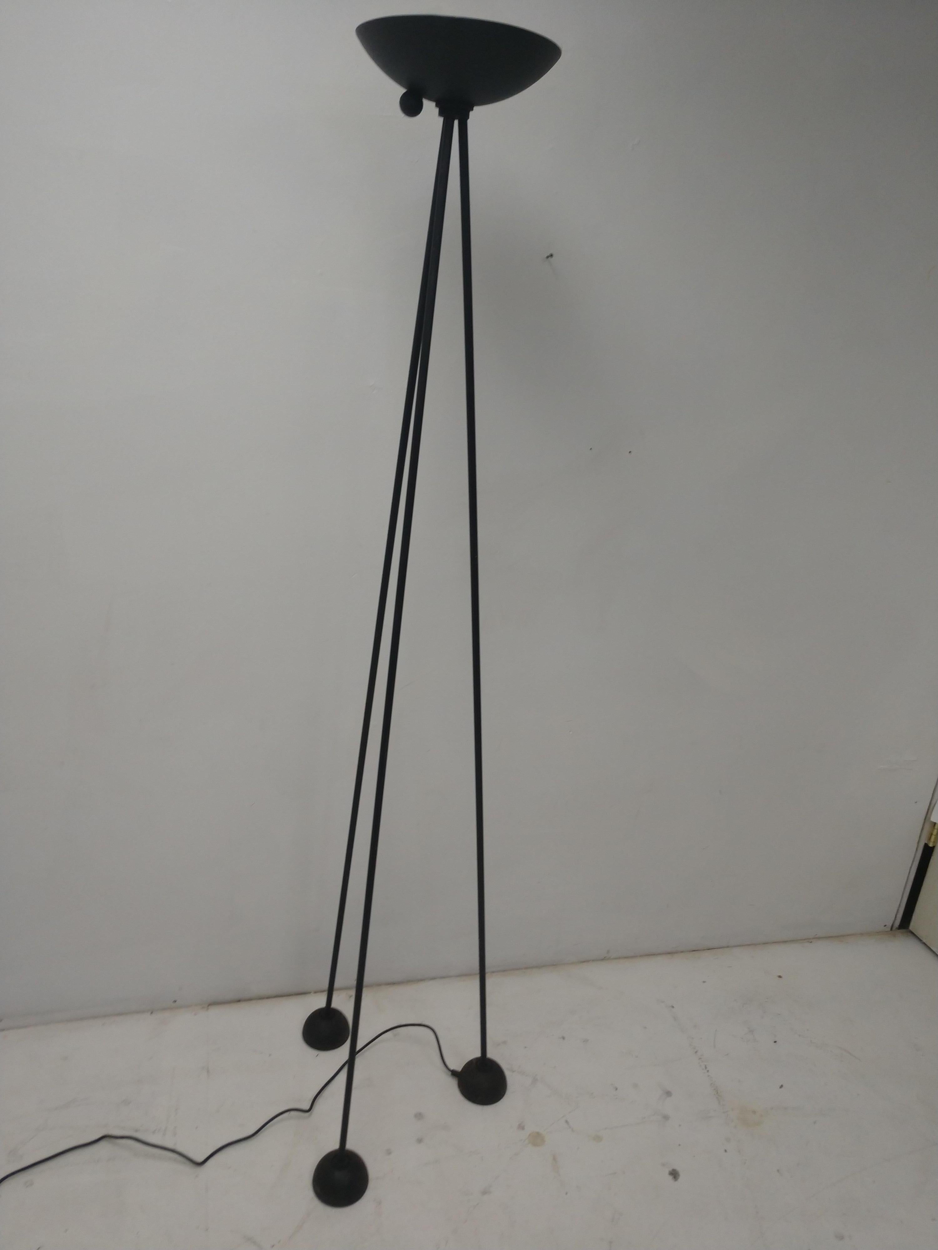 Sleek and sexy Postmodern torchiere floor lamp by Koch & Lowy. Patinated finish on the steel rod legs and cast feet. Halogen bulb which has a dimmer switch. Stands very firm.