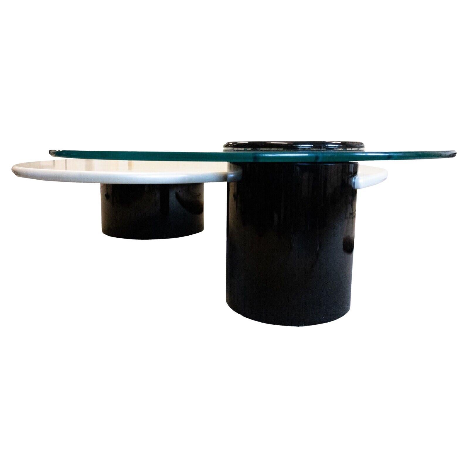A Post Modern stunning coffee table by Canadian brand Rougier. This sculptural table features two large black laminate columns, a pearlized finish laminate table top and a rotating glass top that can swivel out (or be removed entirely). In excellent
