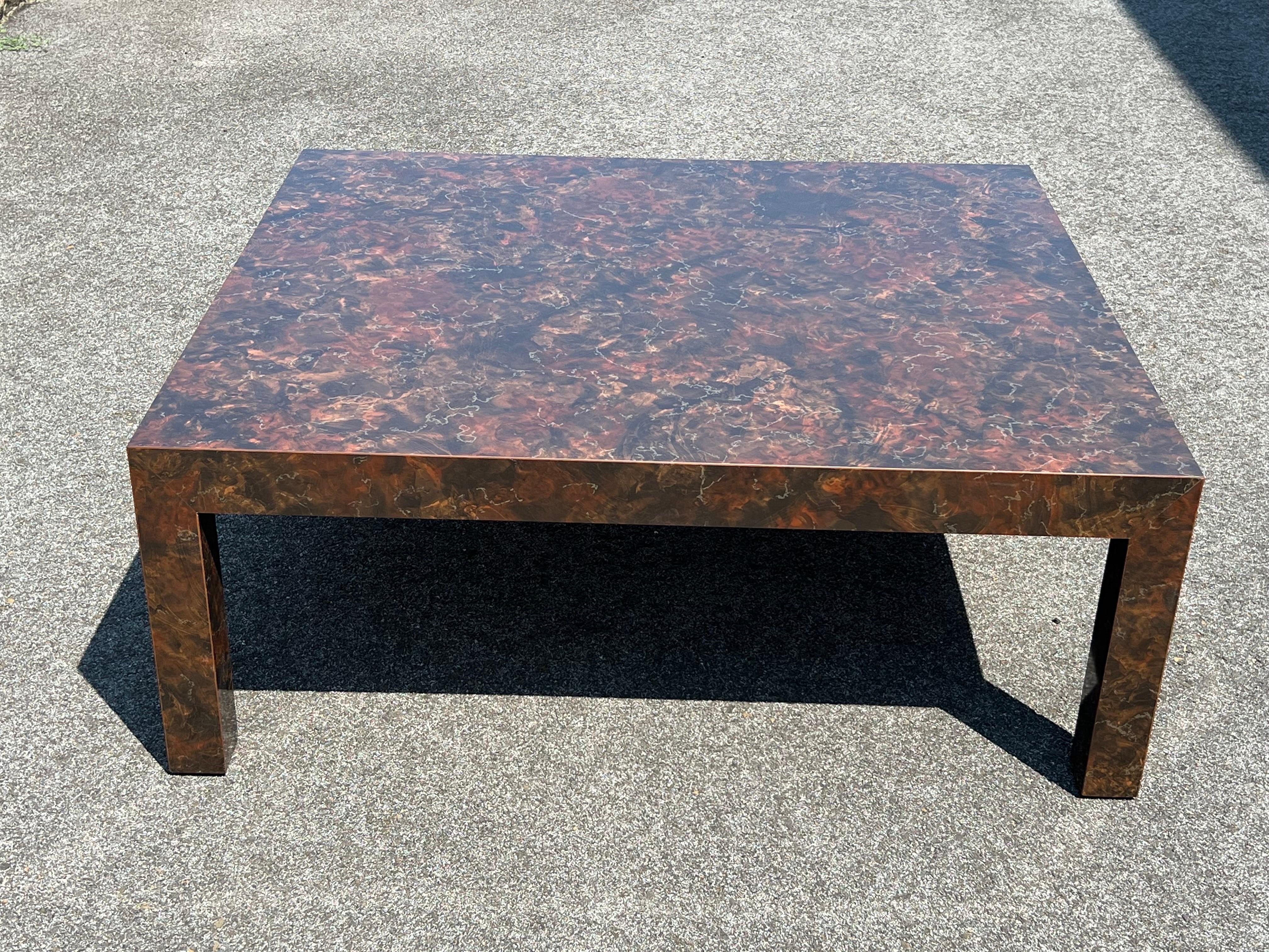 Post Modern Laminated Tortoiseshell Coffee Table. Mid Century Post Modern Laminate Tortoiseshell End Table. Square table with earth tones of brown, gold and orange. Nice oversized size for a large space. Matching sofa table, and two end tables are