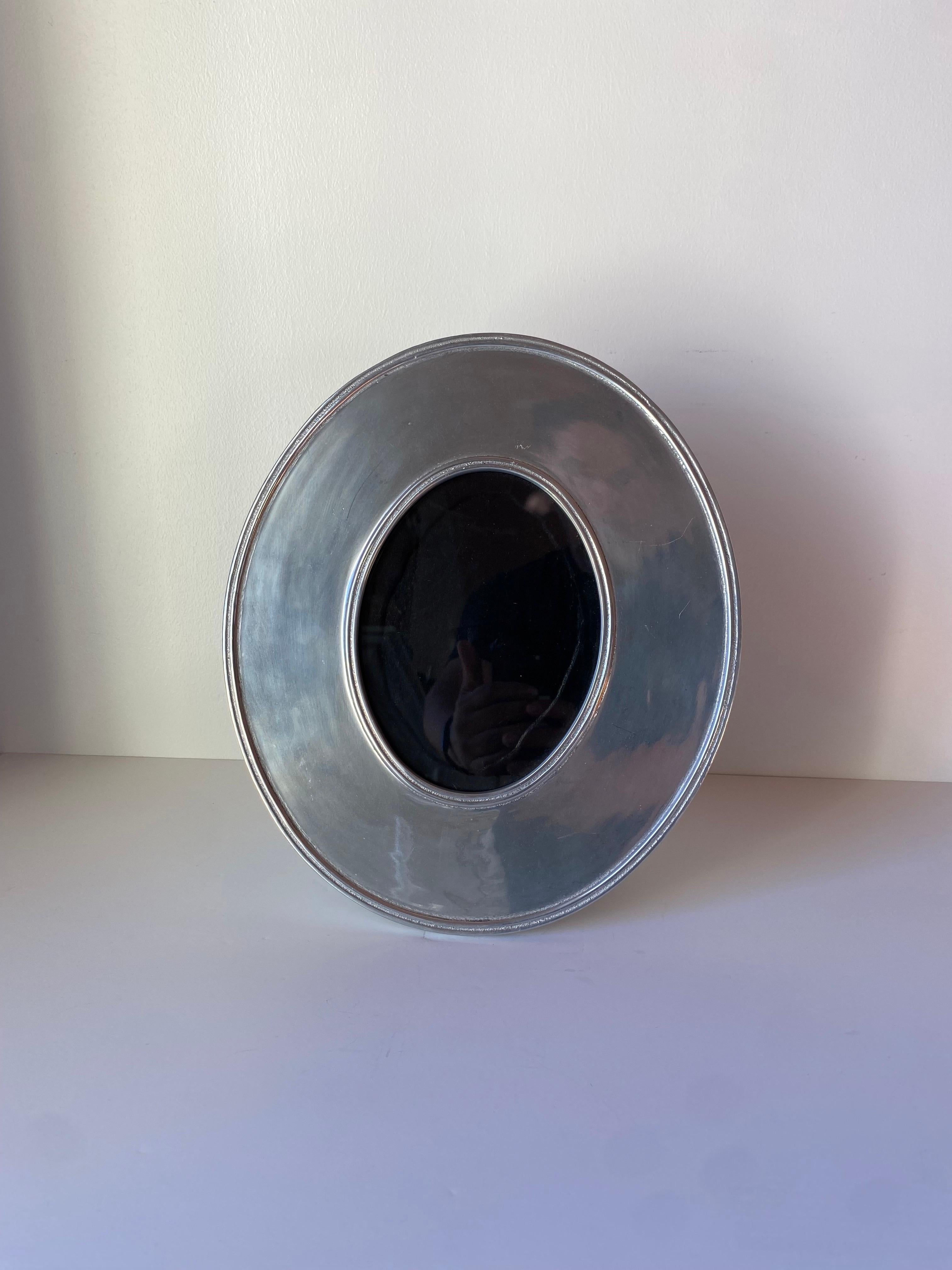 Late 20th Century Post Modern Large Oval Disc Silver Plated Metal Photo Frame For Sale