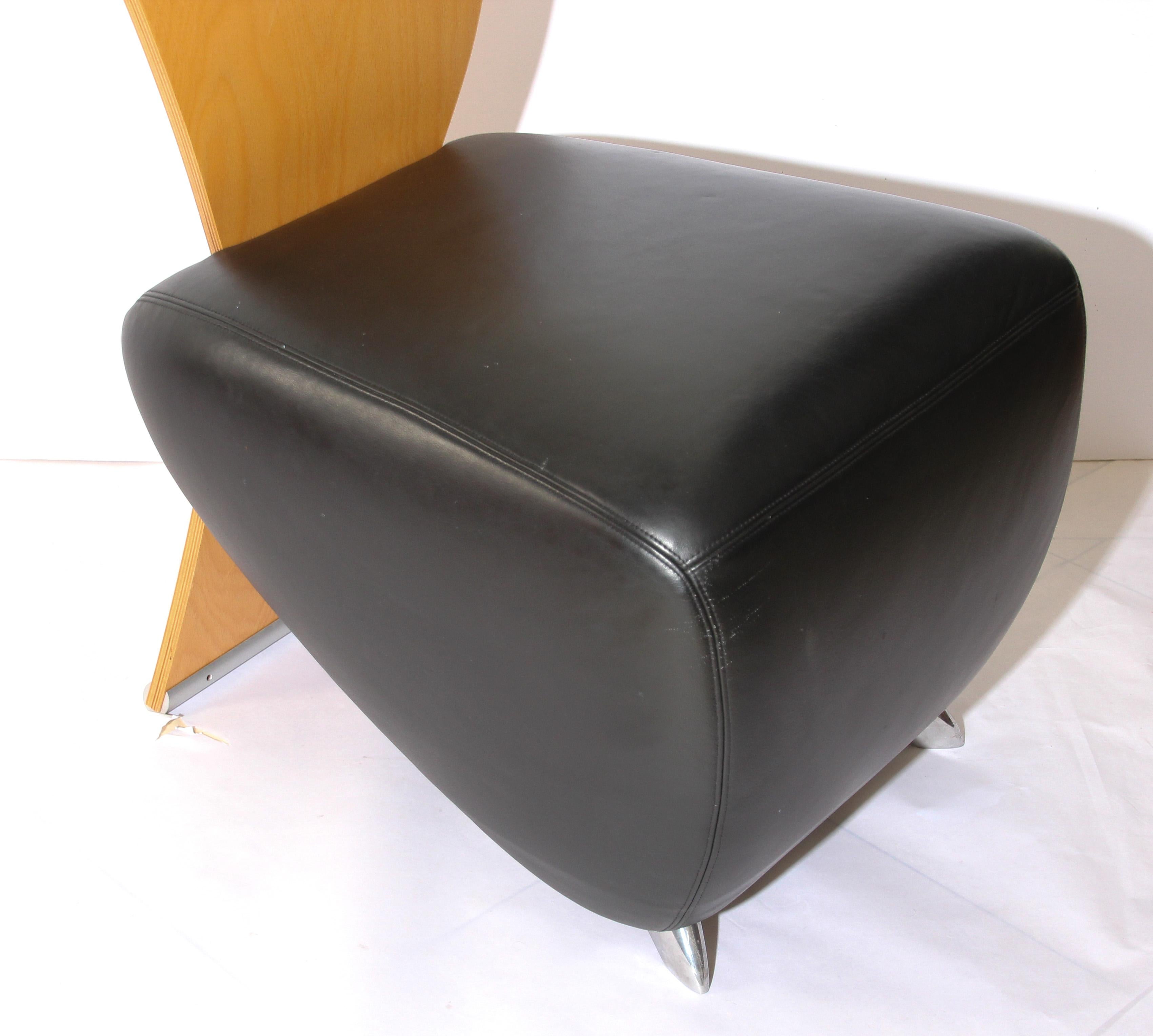 Postmodern black leather Bobo easy chair.
Bobo was designed by German architect Dietmar Scharping in the early 1990s to fill the need for sculptural seating program that would look good from any perspective and suit a wide range of environments.