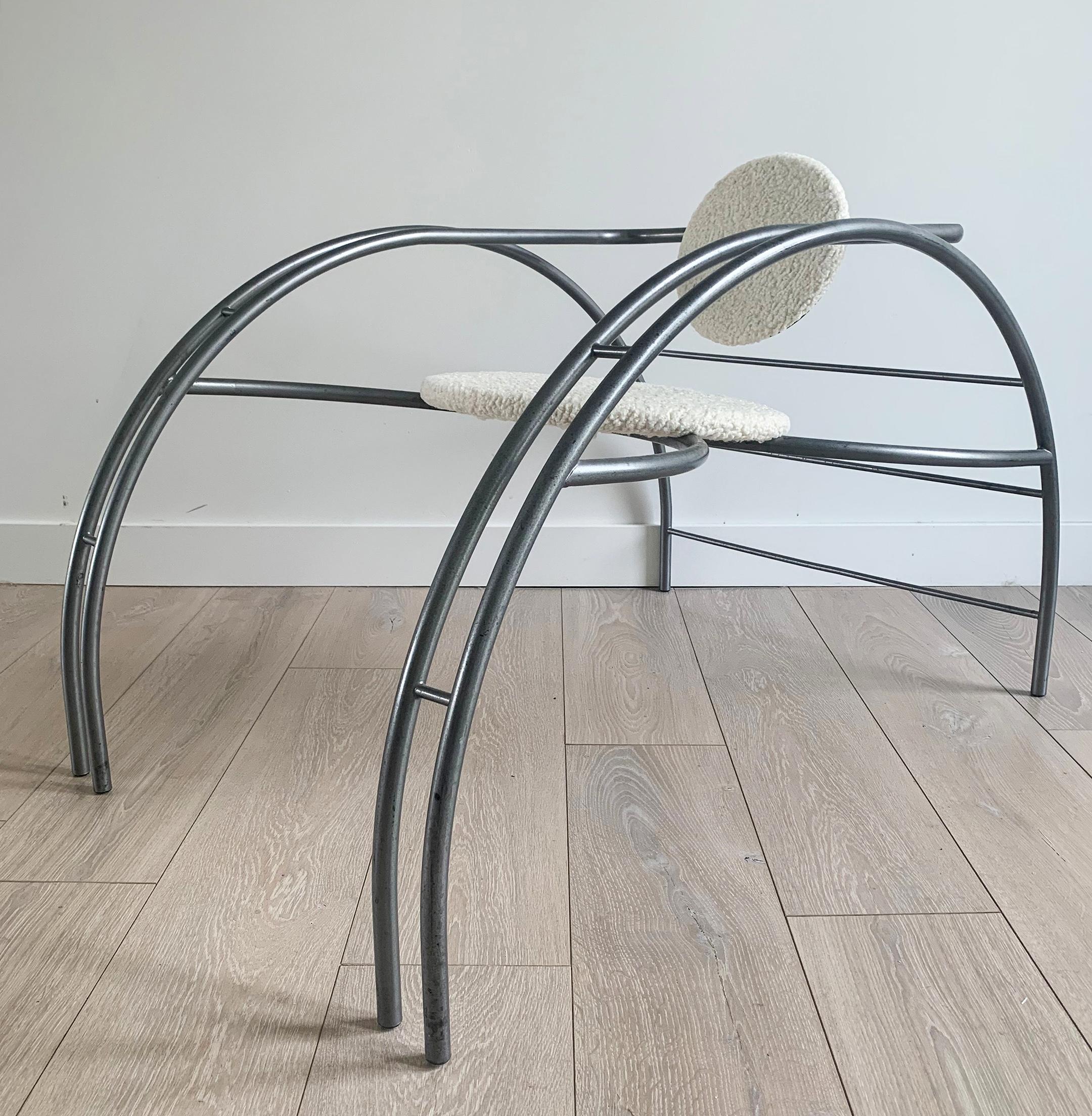 An absolutely stunning Quebec 69 spider chair by Canadian Postmodern Design Group Les Amisca. This chair was designed in the 1980s and features a rounded steel Art Deco style body with a round seat and seat back that are upholstered in a luxurious