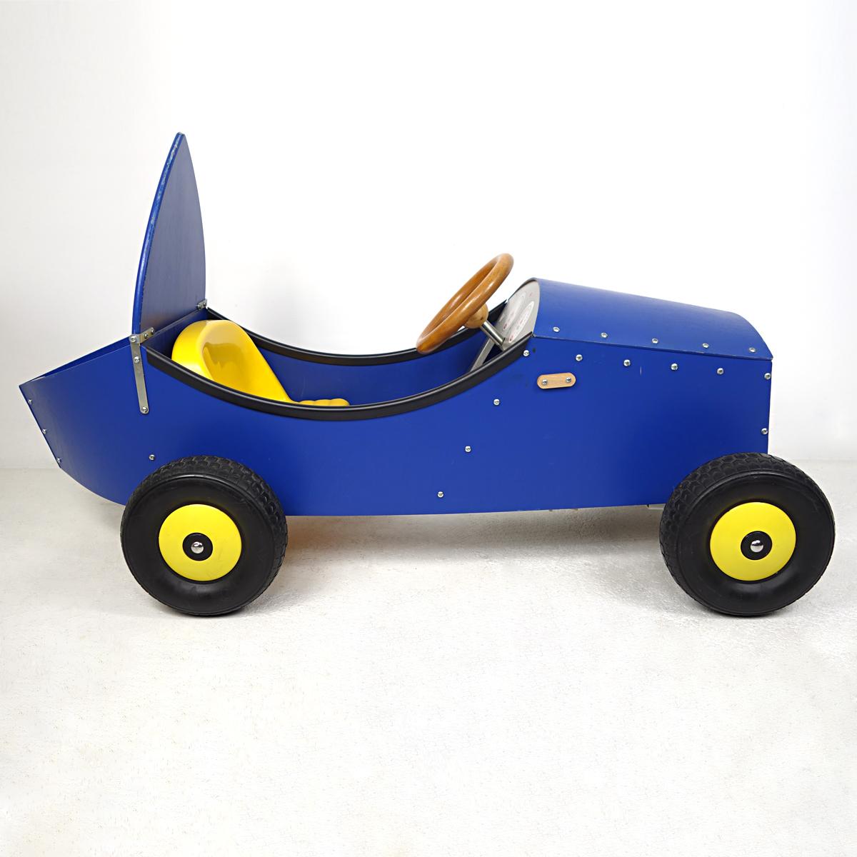 This pedal car was designed in 1998 by the world famous designer Philippe Starck for French retail group La Redoute. It was part of the Good Goods collection. 
The pedal car was produced in a limited edition of 500 units.