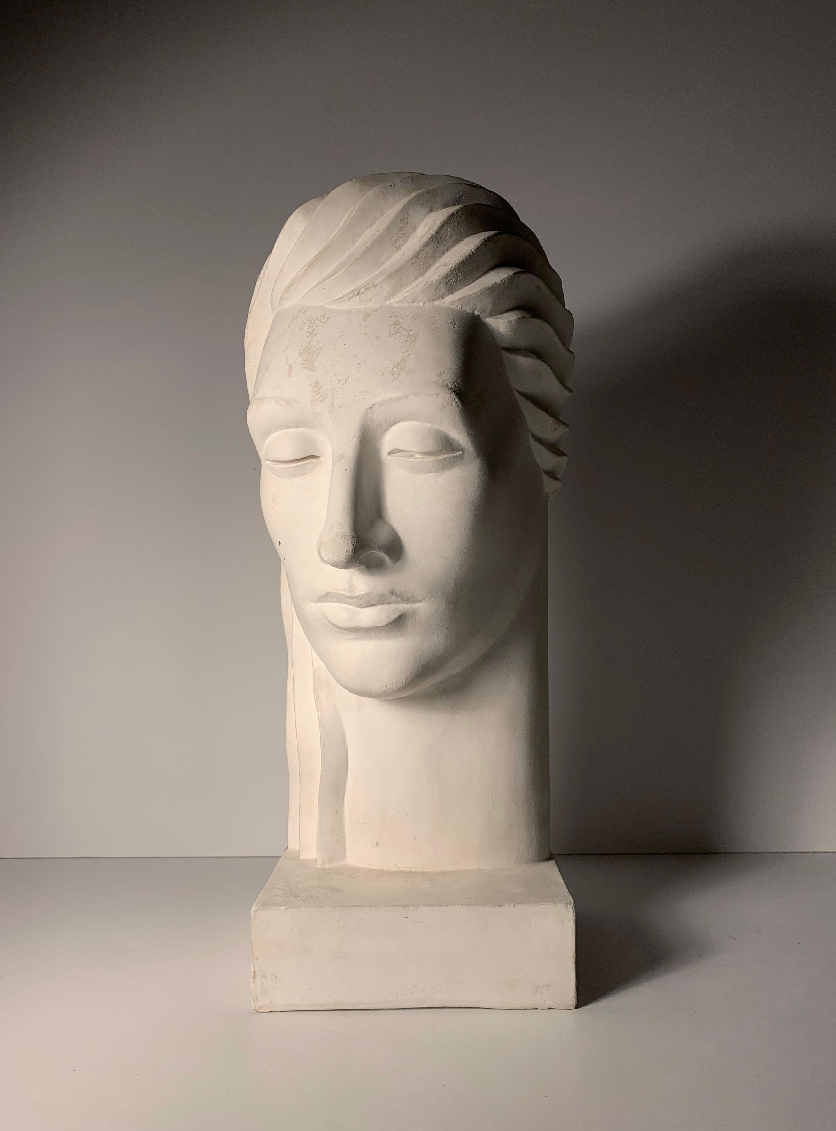 A large Post Modern Deco style Plaster Bust Sculptures.  Signed on top of the base 