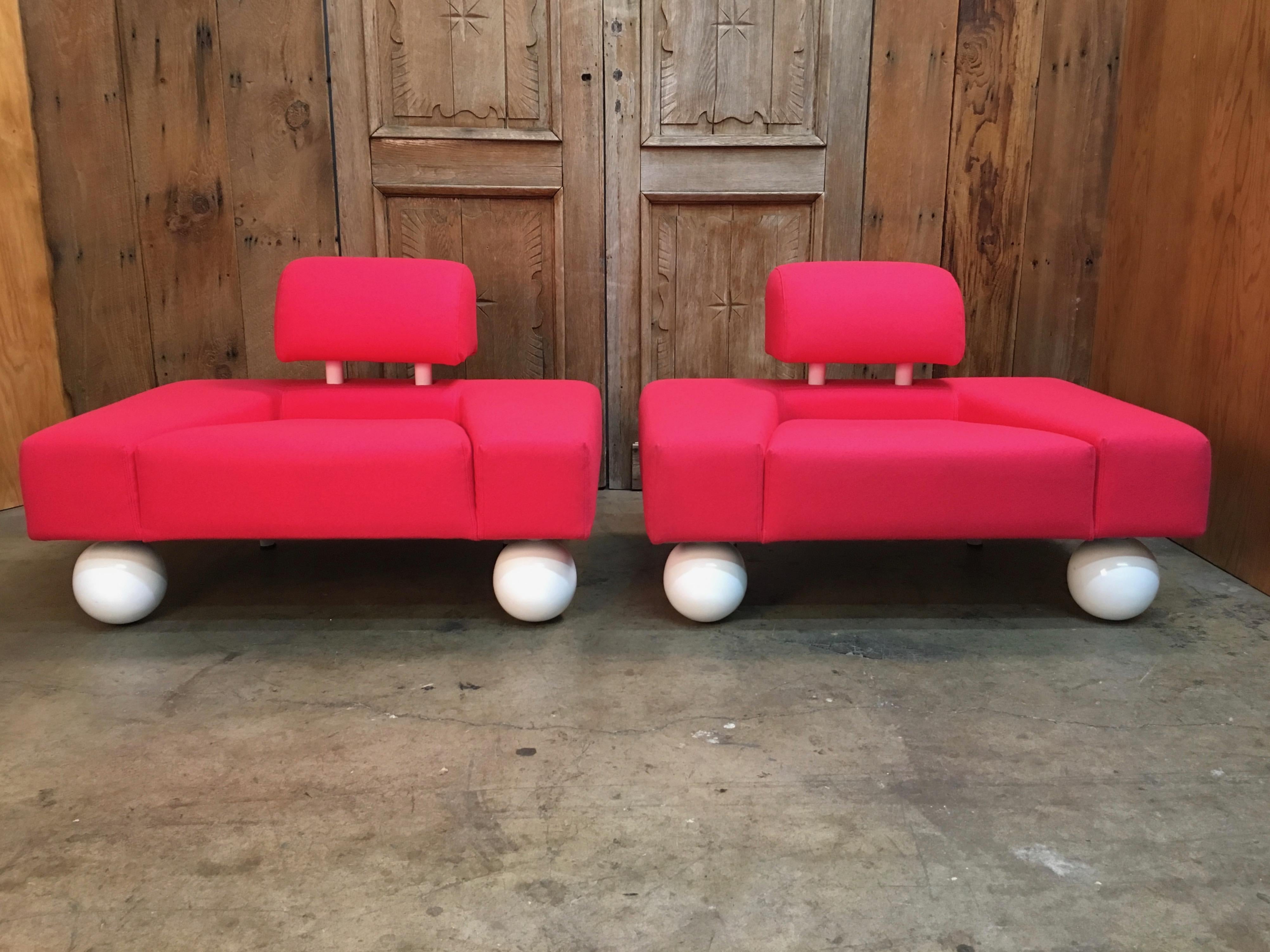 Rob Eckhardt for Pastoe hot pink Postmodern lounge chairs with metal globe front legs.