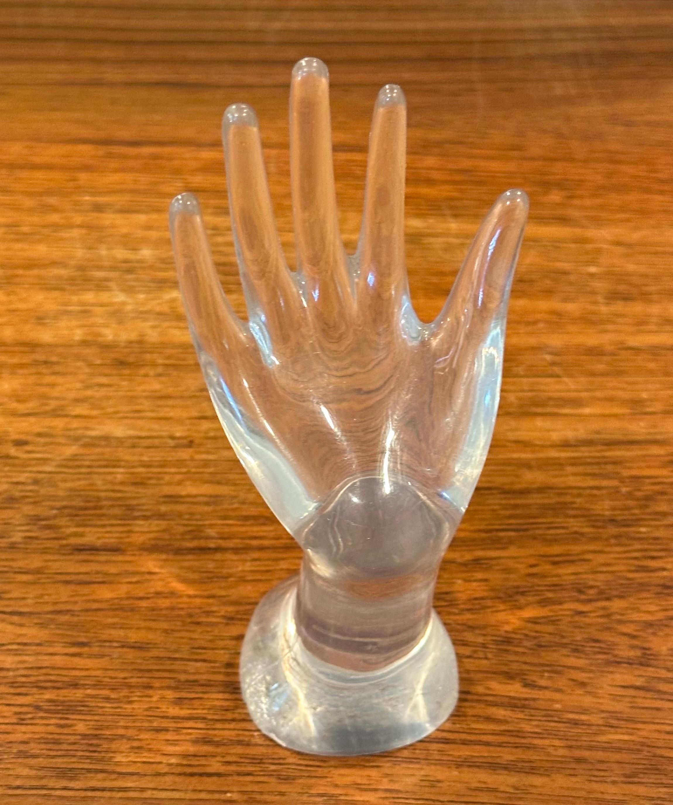 Cool post-modern lucite hand sculpture ring holder, circa 1980s.  The piece is in very good vintage condition with no chips or cracks and measures 2.5