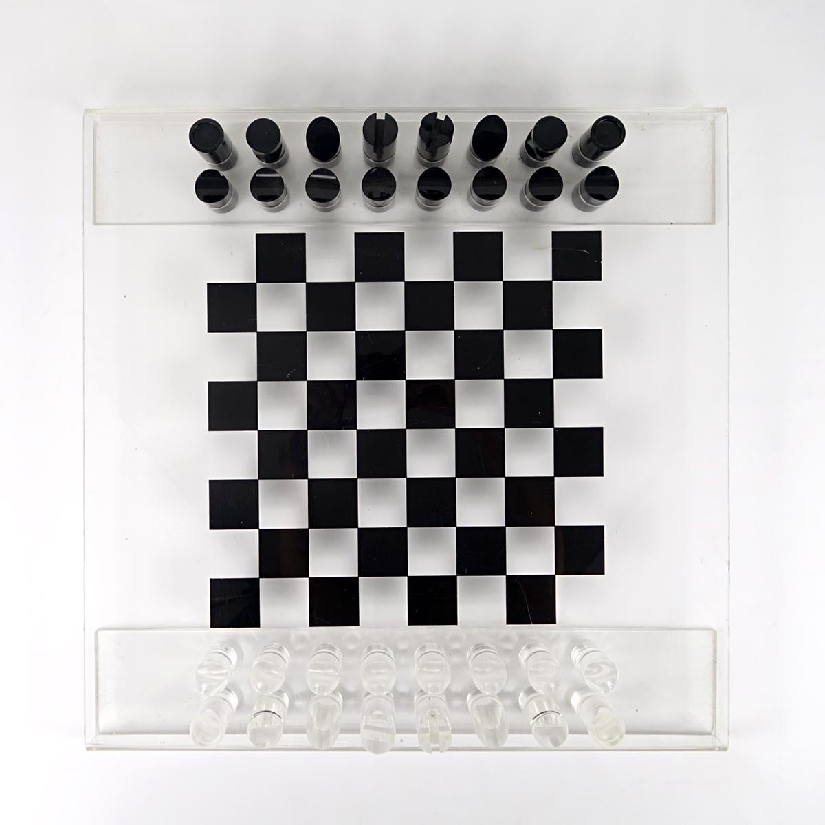 Very stylish chess board and game pieces made of Lucite.
The board has been elegantly folded on its edges giving it a nice height.
The board has a few surface scratches and the pieces have a little crazing due to age and use.