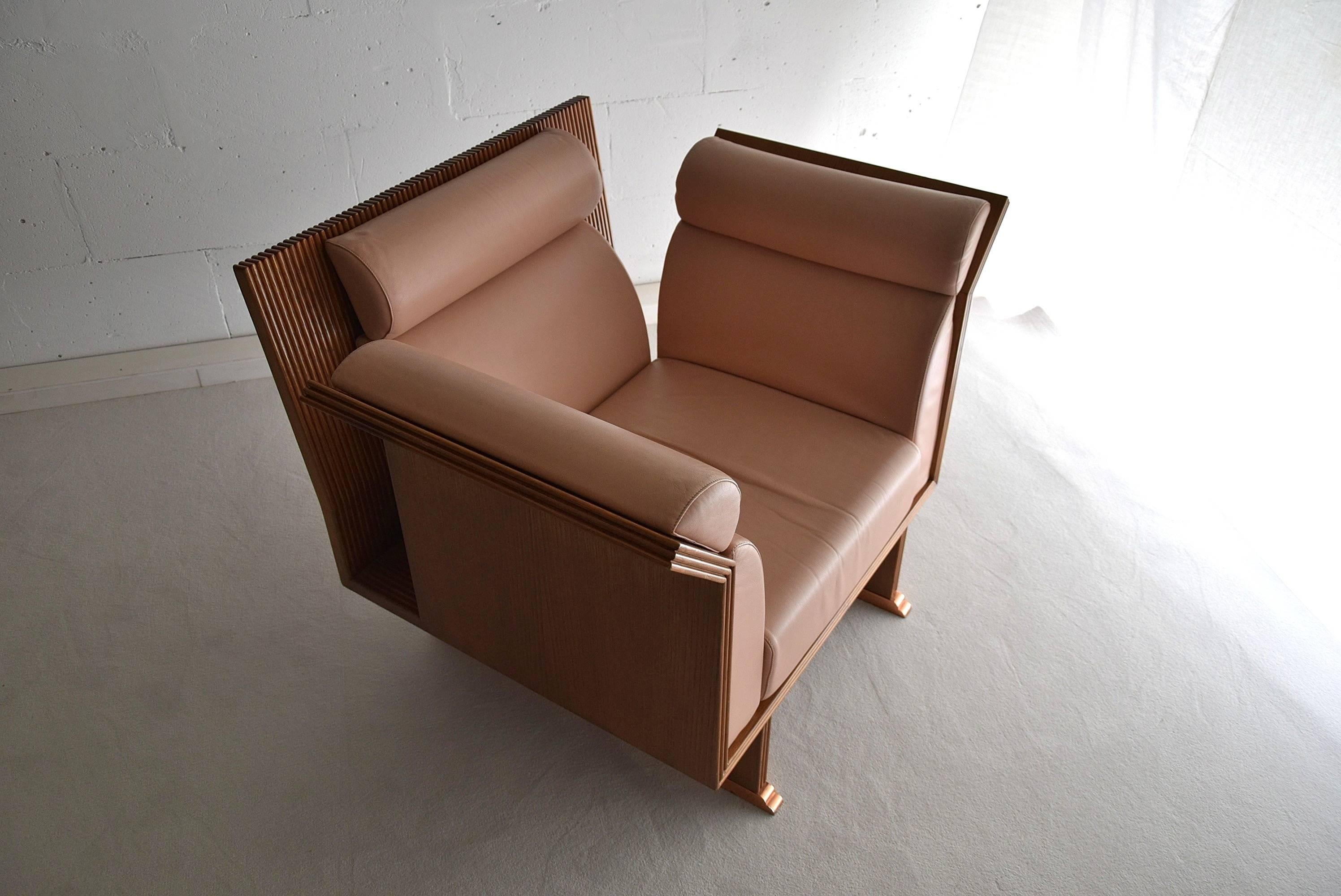 Introducing a stunning pair of Pretenziosa arm chairs designed by Ugo La Pietra in 1983 for Busnelli Italy. These neo eclectic post modern chairs are the epitome of elegance and sophistication, with their sleek Jatoba wooden frames and gorgeous