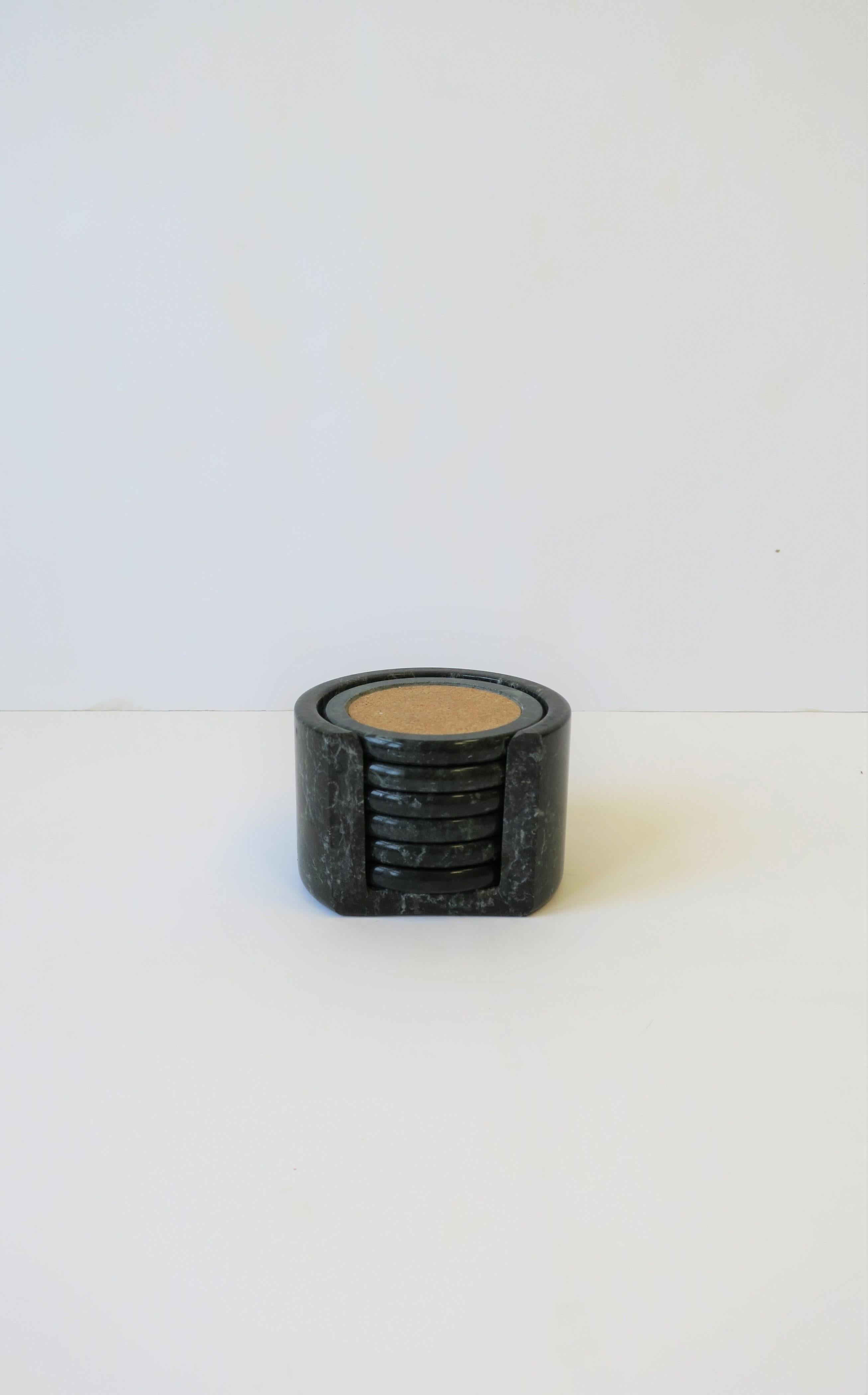 A set of 6 Postmodern dark green and white marble and cork cocktail or drink coaster set with holder vessel. Set includes 6 coasters and one holder vessel.

Measures: 2.78