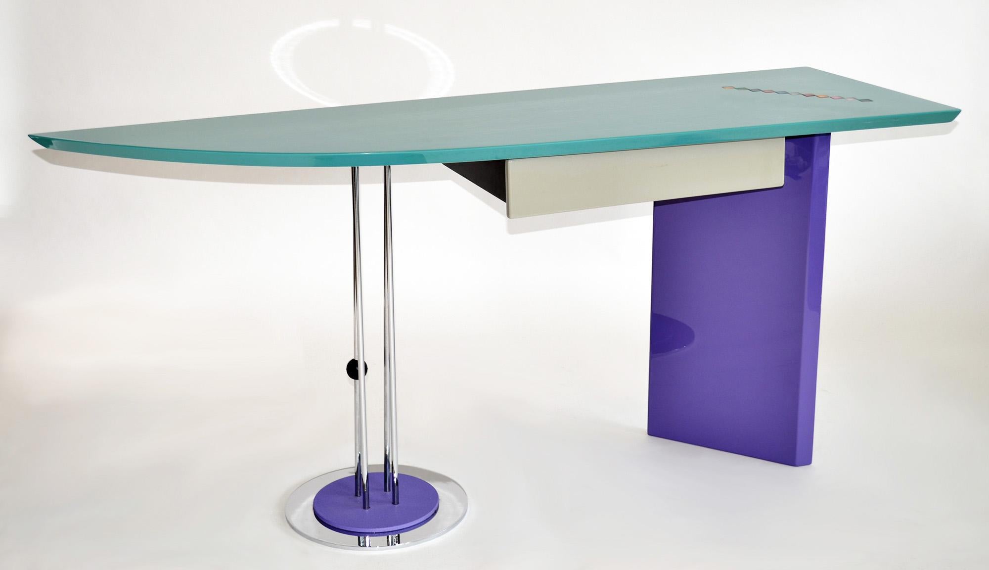 Post Modern Memphis Deco style writing desk by Saporiti Maurizio Salvato 1980s.
Bright 1980's Memphis-inspired, 'Miami Vice' color scheme in Purple, Turquoise and Gray gloss lacquer with colorful inlaid glass tile detail. Single Drawer. Lacquer,