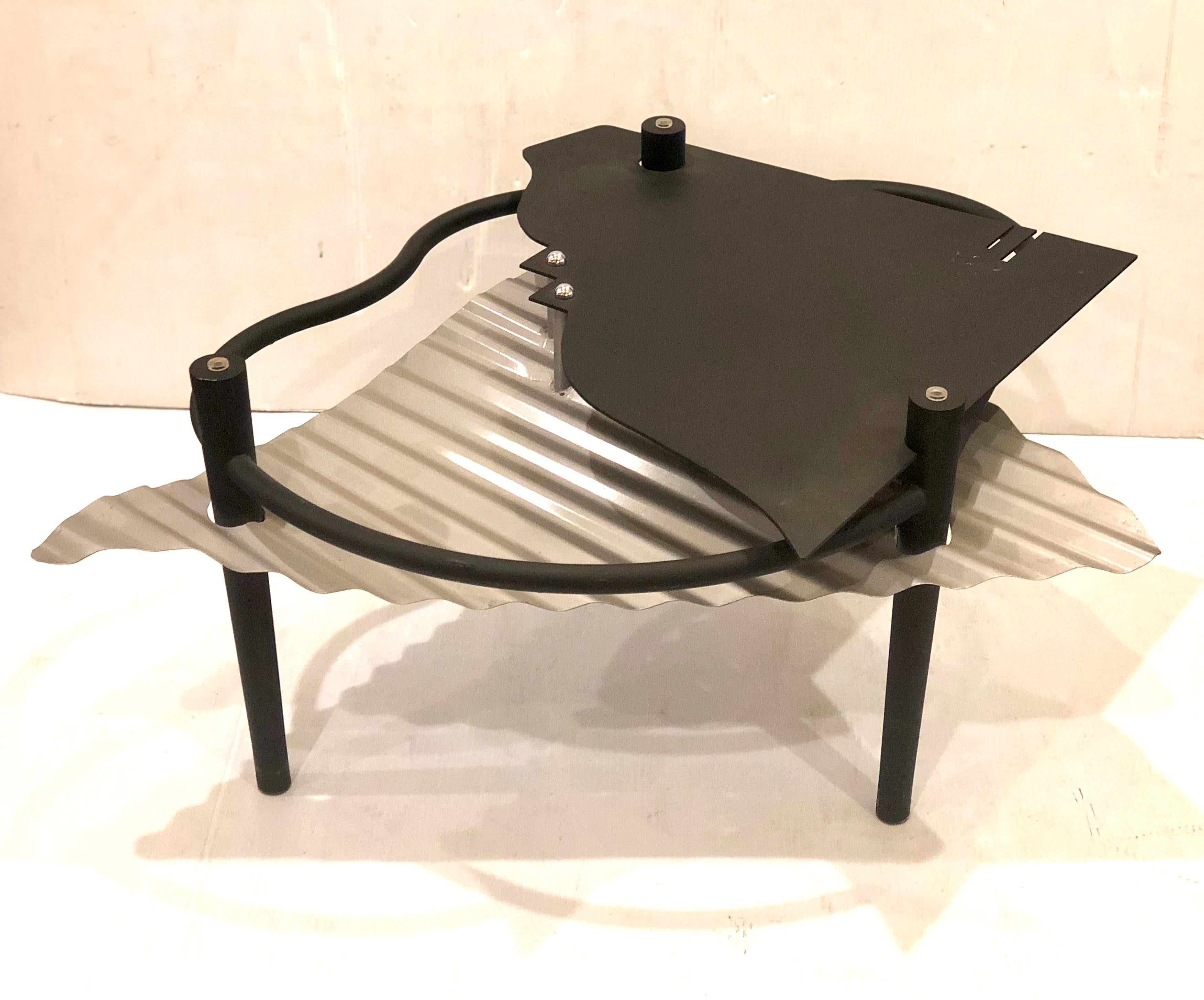 Rare coffee table base by Design Institute America, in metal black mate and silver powder coated base, trigged takes a round glass or freeform glass, with chrome accents the glass its not included so the customer can put any shape and size that