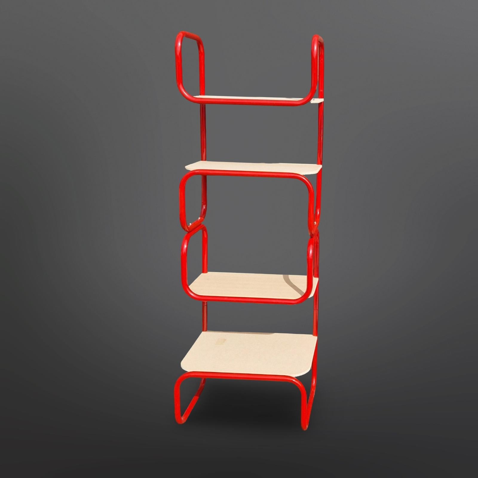 1970s Post modern modular shelving units. Designed in the manner of the Memphis group and the Bauhaus movement. It has a red lacquered steel frame with MDF shelves. The bottom shelve measures 51cm in depth while the three upper ones measure 41cm in