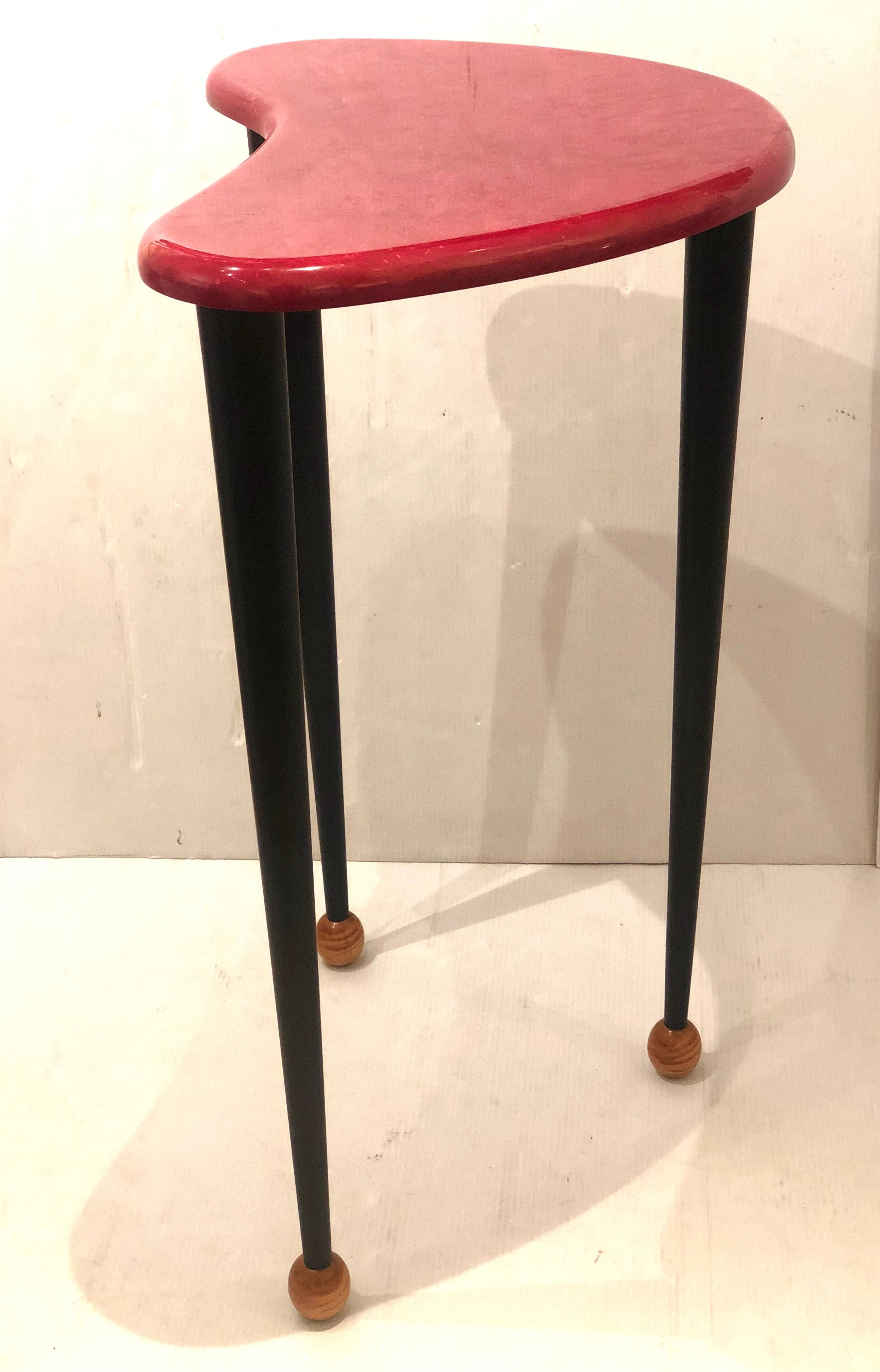 Nice and well done wood tall cocktail table boomerang shape, in pink lacquer finish ebonized black legs, with walnut ball feet , signed and numbered as shown.