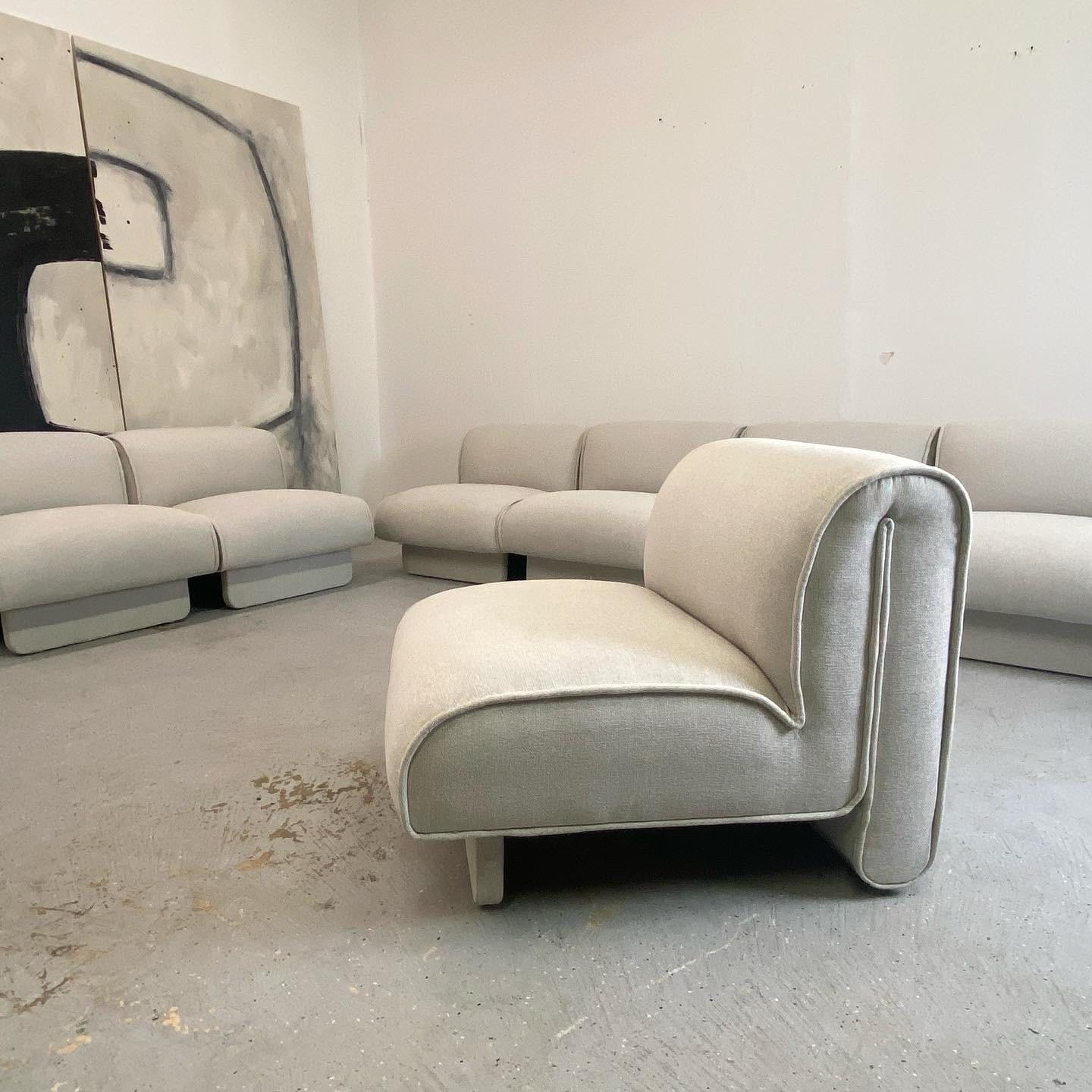 This is a vintage seating group fully restored in a sturdy woven fabric. These have a unique curved structure with a sculptural look that seem to float. Each element measures 31