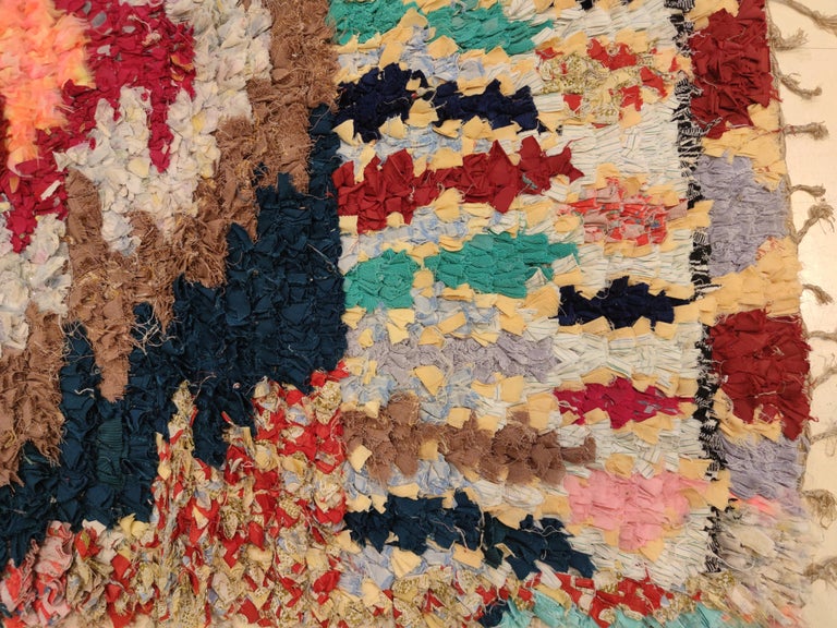 Woven by using exclusively recycled yarns of various type, ranging from cotton to lurex, Boucherouite Berber rugs represent a unique facet of Moroccan textile art. These are the product of semi-illiterate Berber people living in small villages and