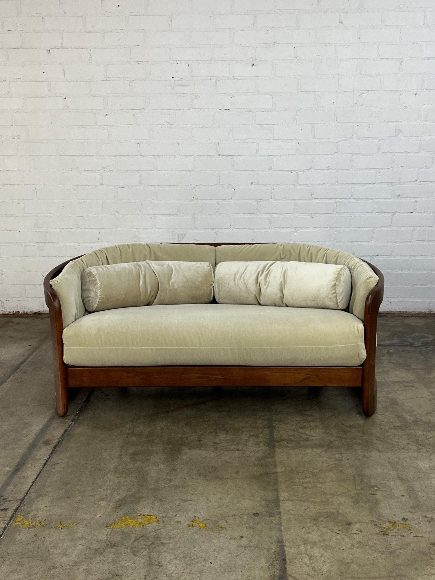 W61 D37 H26.5 SW53 SD26 SH18

Fully Restored Loveseat Sofa in excellent condition. Item features a newly refinished solid oak frame in a medium dark walnut. Sofa has new straps, new foam, and new fabric. Fabric is a high pile velvet very similar to