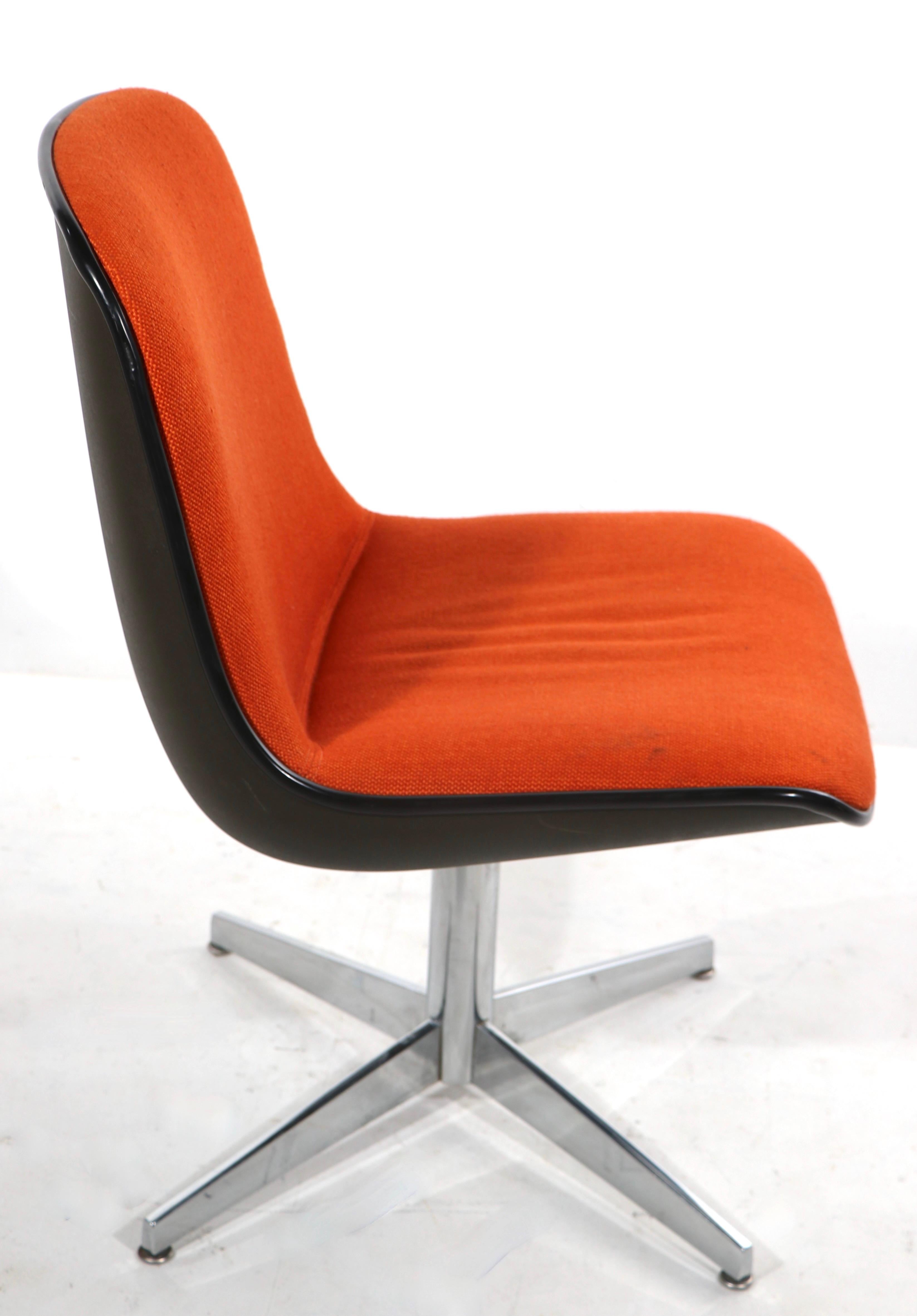 Sharp office, desk, side, or dining chair(s) having a continuous orange tweed seat and back, with dark gray plastic shell, on a bright chrome base and legs. The chairs are stationary, ie they do not swivel or tilt. Both are in very good, original