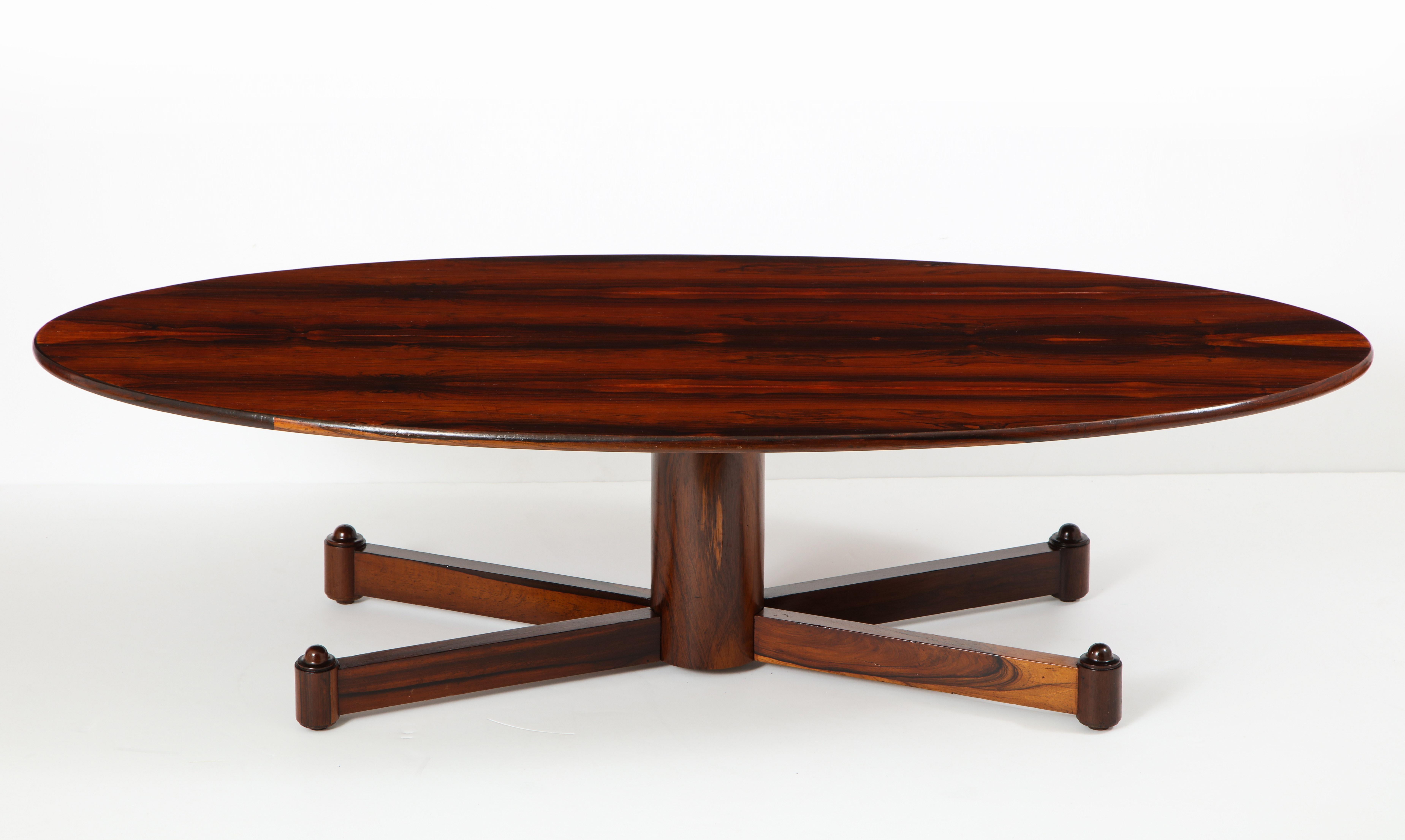 Brazilian Mid-Century Modern Wood Oval Coffee Table, Brazil 1950s

This 1950s elegantly elongated oval coffee table is characteristically Brazilian Mid-Century Modern. It consists of a naval plywood top nicely covered in highly figured wood veneer