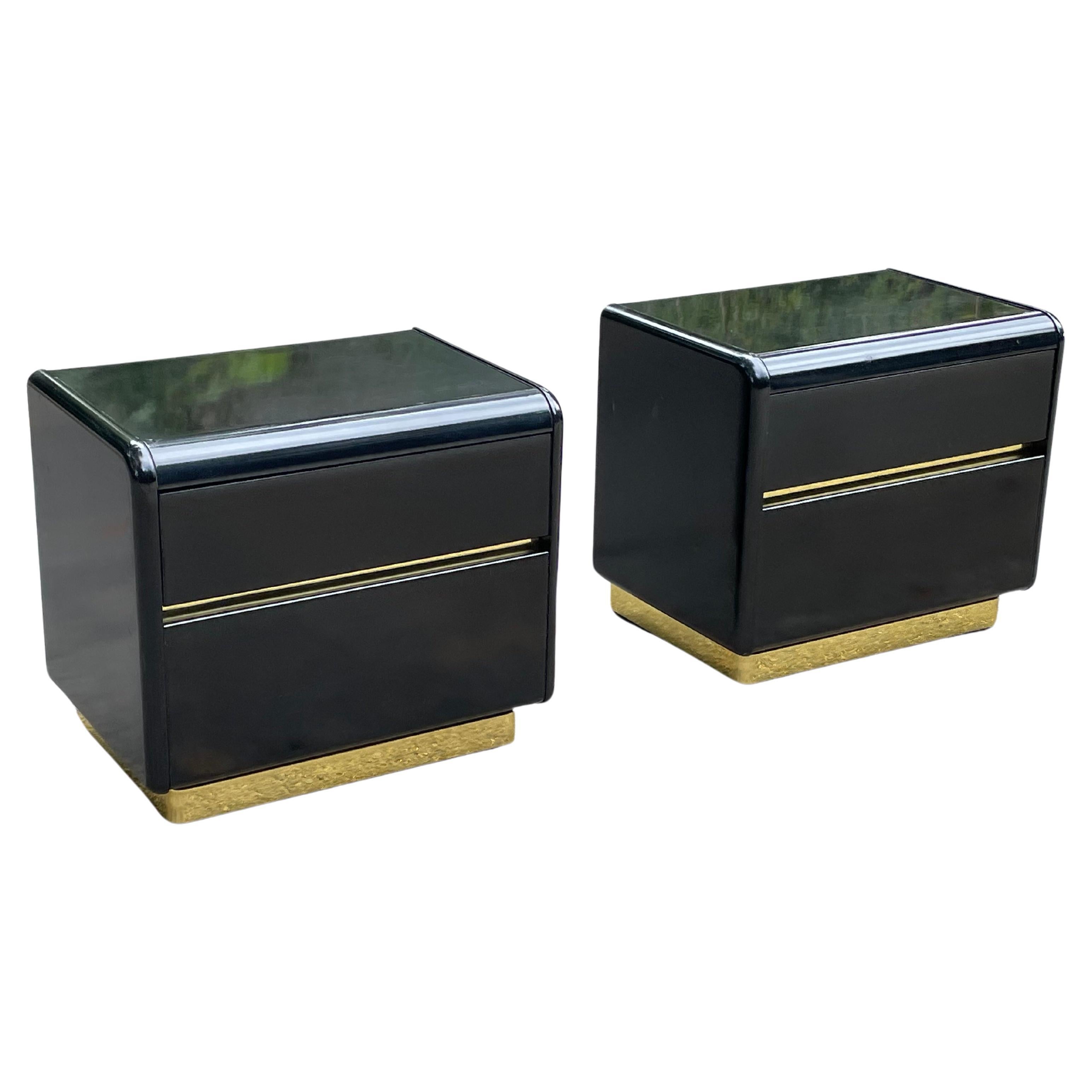 Pair of mid-century 80s black lacquer & brass nightstands by Lane. Gorgeous post modern design. The black lacquer is smooth. The brass glows.

Two drawers on each. Signed with label inside top drawer.

Very good vintage condition. Very minor scuffs