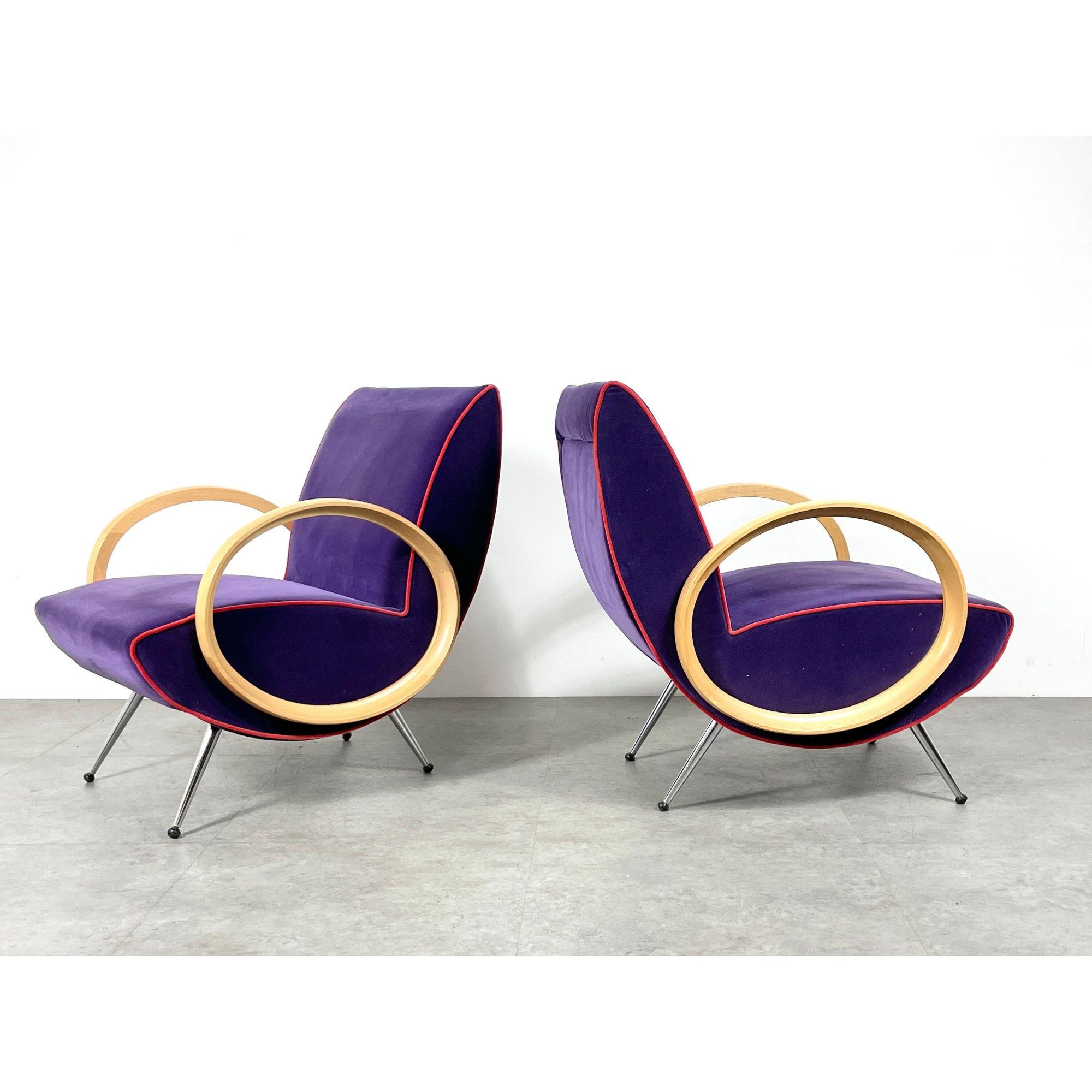 Vintage Pair Post Modern Chrome Italian Lounge Chairs In the Manner Of Marco Zanuso

Incredibly unique pair of sculptural lounge chairs circa 1990s
Post modern Italian design with sculpted beech ellipse armrests
Upholstered in purple micro suede