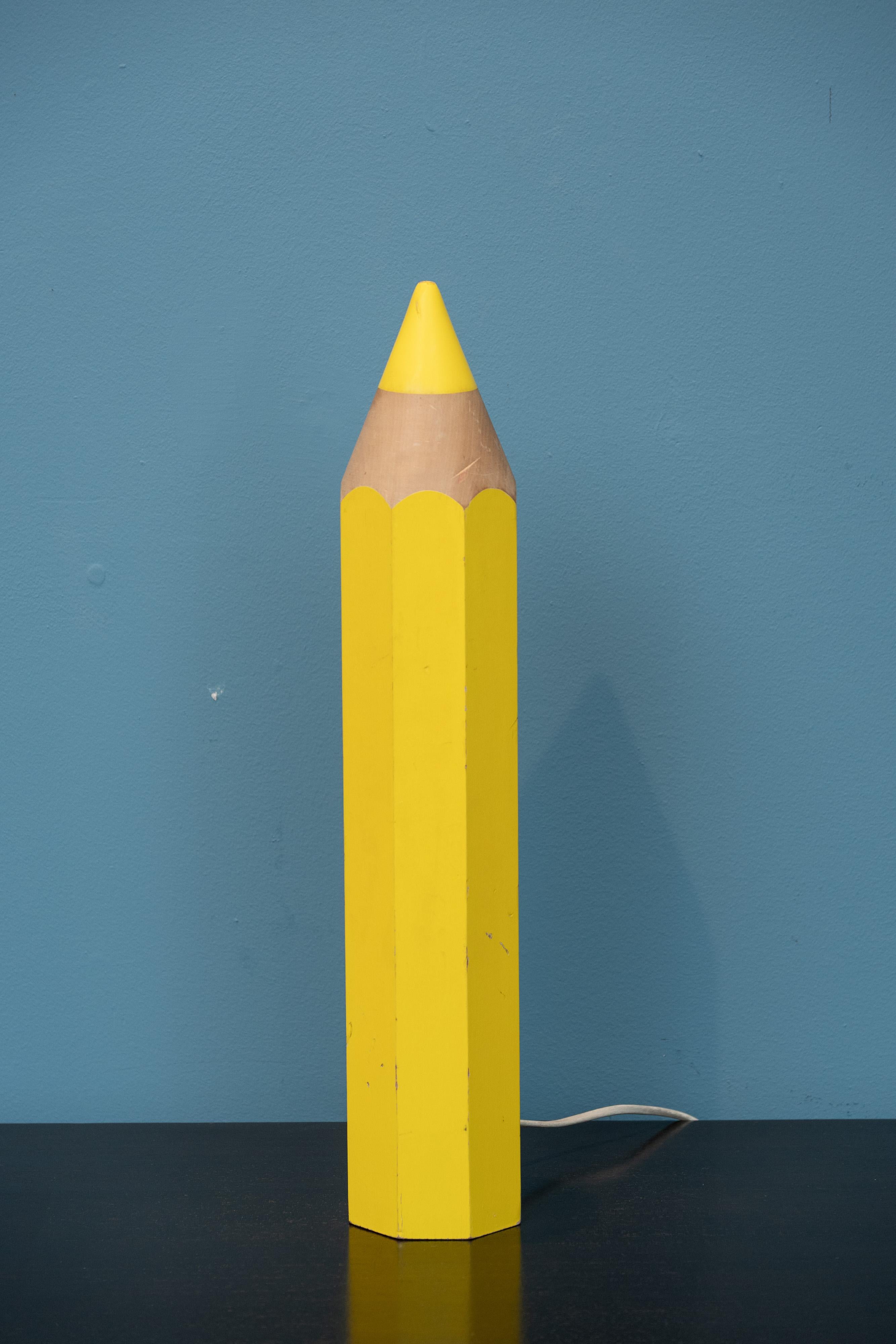 Post Modern design pencil form halogen table lamp by Michel Aroutcheff for Vilac, France. Fun pop art table lamp that is modeled after a pencil but has a built in halogen lamp feature. In good original condition with signs of age and use. New