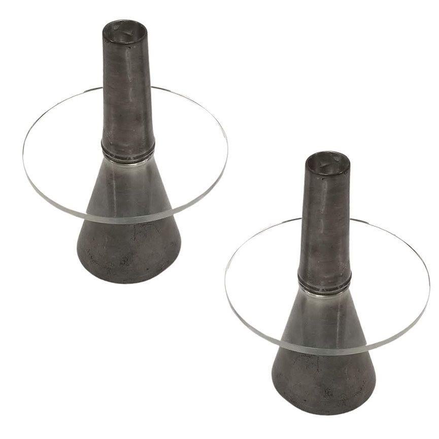 Post-modern pewter candlestick holder pair by Royal Selangor featuring a geometric cylinder with a floating glass guard in the center. The candlestick takes from the sweep of Memphis based design popular through the 80s and early 1990s.

Measures: