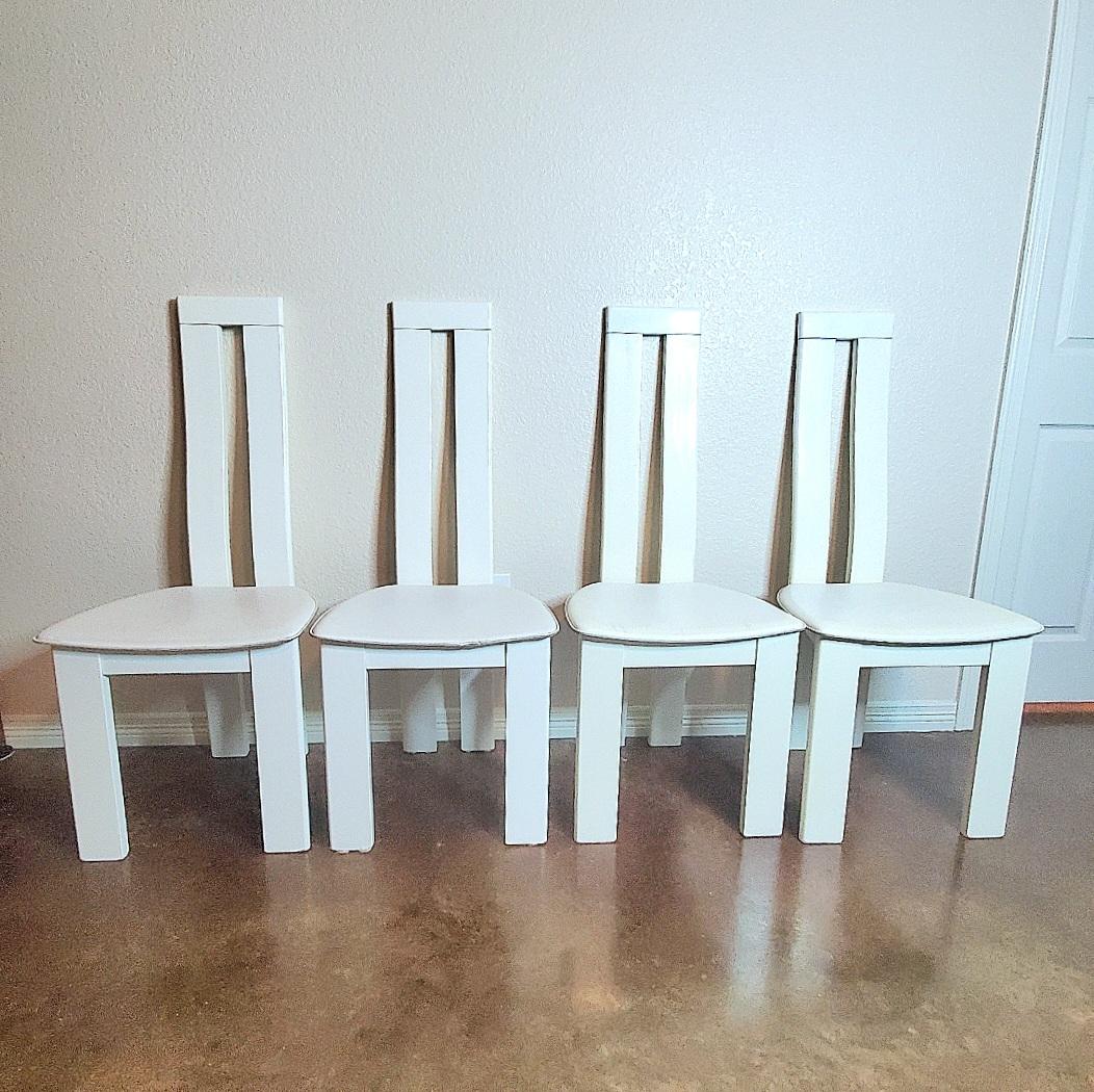Set of four Italian postmodern dining chairs by Pietro Costantini
Beechwood covered in white lacquer and original leather seating.
Italy, 1970s or 80s