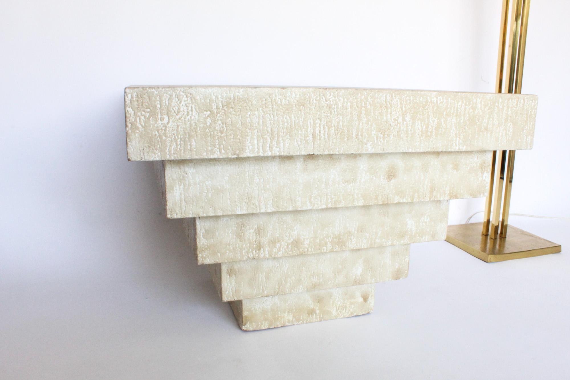 Excellent example of 1980s Postmodern design, beautiful geometric stacked occasional table that can function as side table, end table or coffee table. Table has a Postmodern design but also an organic element which is the textured plaster finish and
