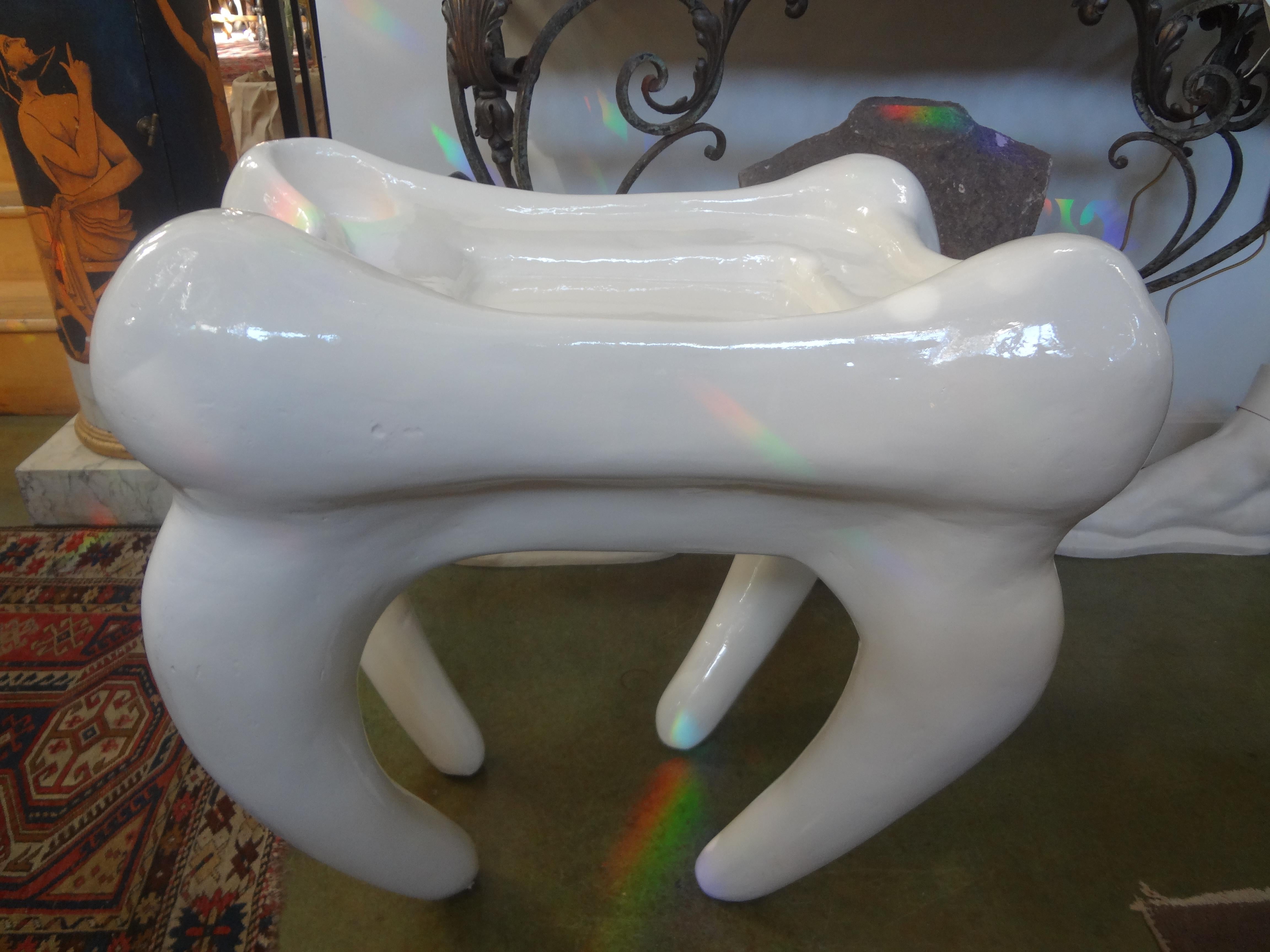 Postmodern plaster table in the shape of a molar.
Stunning one of a kind postmodern plaster table in the shape of a molar tooth. This unique midcentury John Dickinson style table in a white lacquered finish is both interesting and function able.