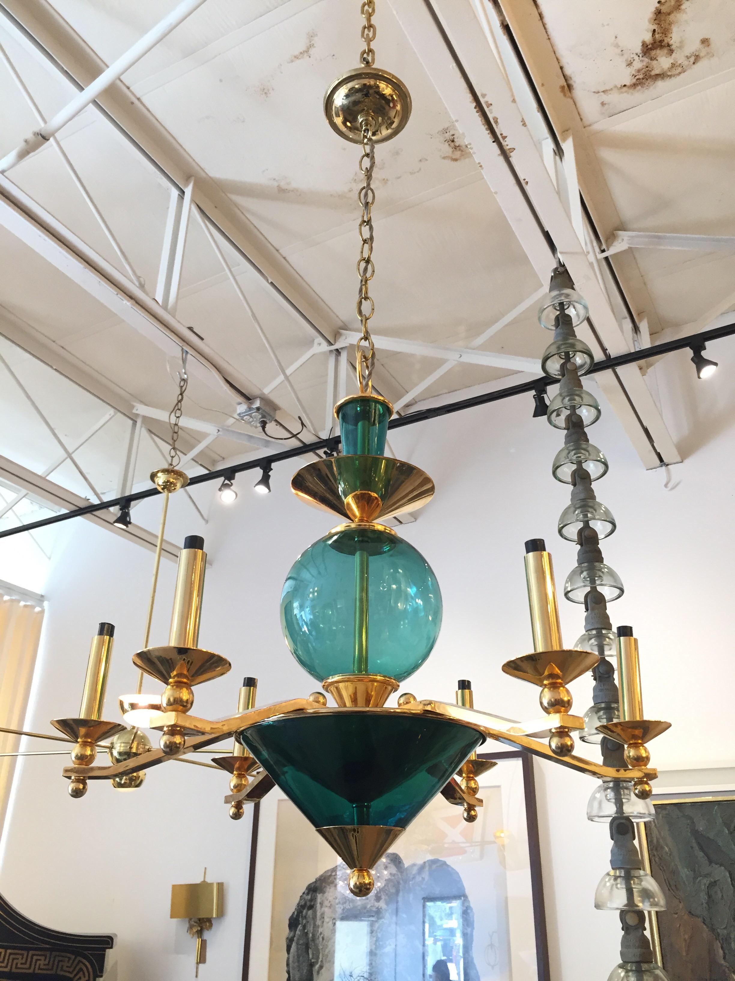 This Italian fixture from the post-modern era (1980's) with green murano glass geometrically shaped and gold gilt brass. Whimsical mini-pagoda bamboo shades are included. Very stylish!
Note: 42 inches long w/ chain and canopy.