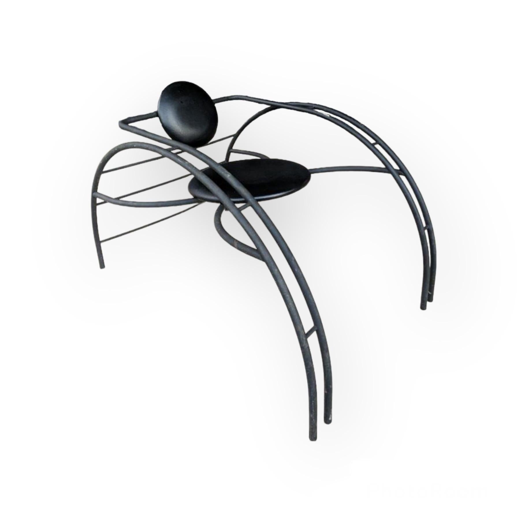 Postmodern Quebec 69 spider chair, designed in the early 1980's by Canadian design group Les Industries Amisco. This piece is truly a statement chair, in a particularly unusual form. The frame of the chair is of black powder-coated steel, and it has