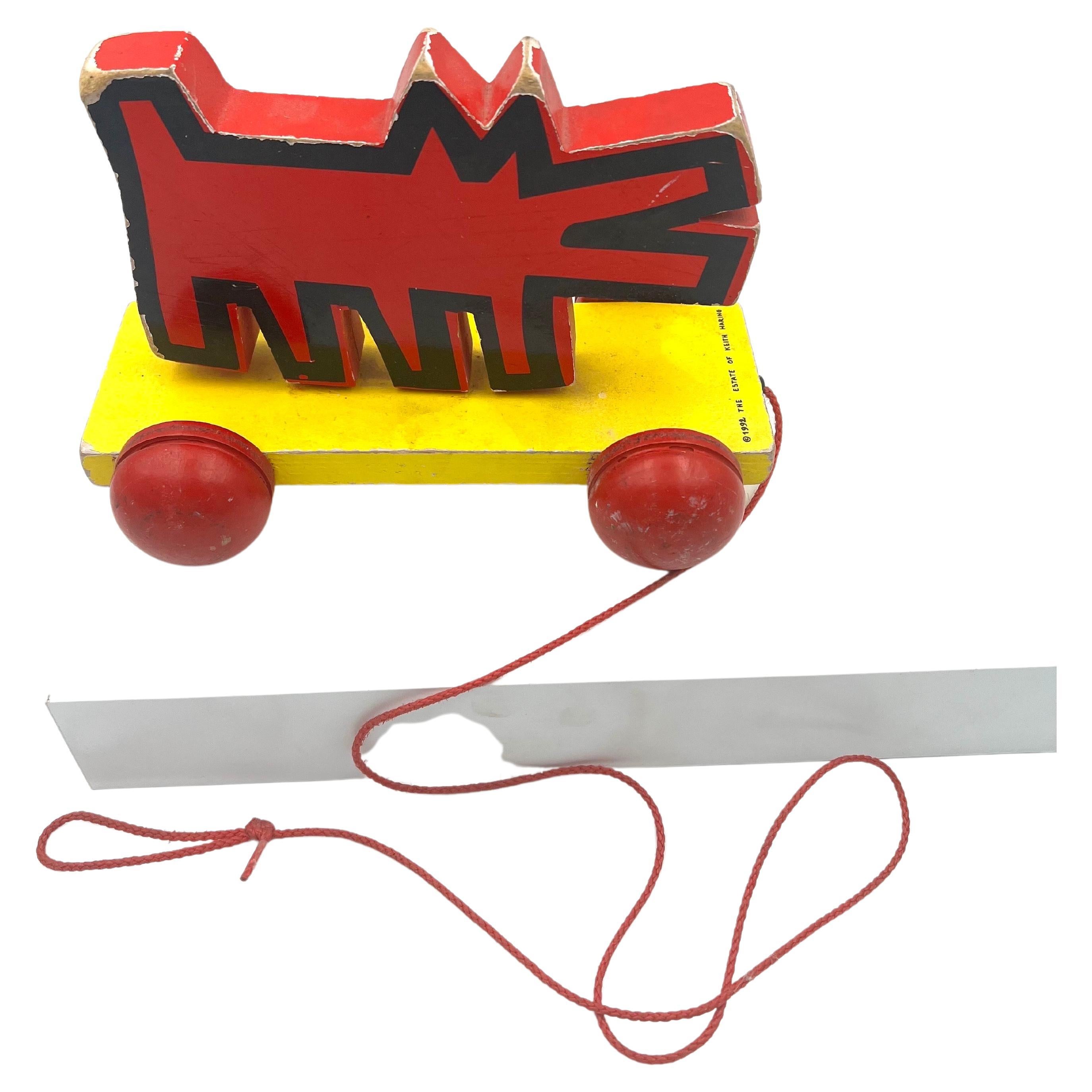 Rare and very collectible pull toy from the state of Keith Haring circa 1992 part of the MOMA collection, made in France wood painted finish well played original condition some scuffs and marks due to age and its a toy.