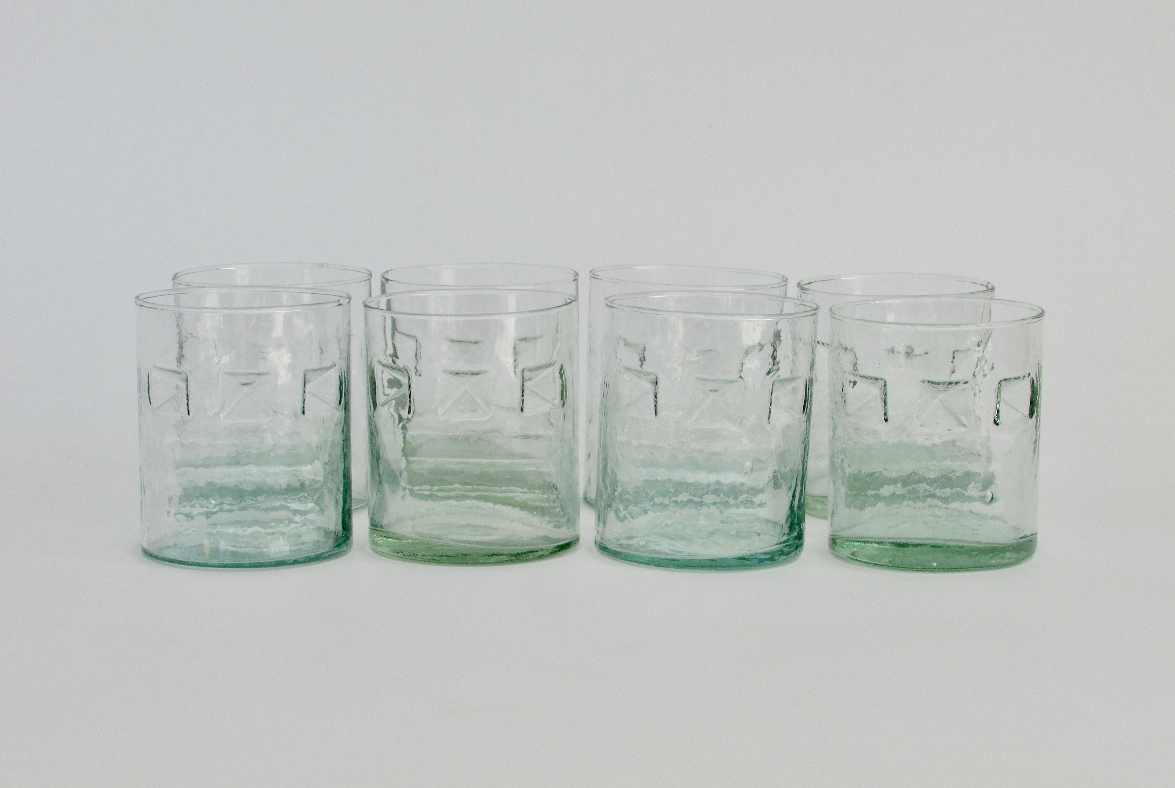 A green hue and a recycled wave texture throughout, these three finger lowball cocktail glasses have the post-modern design style you are looking for. Each one is unique and fits well in your hand. Great for a beach house.