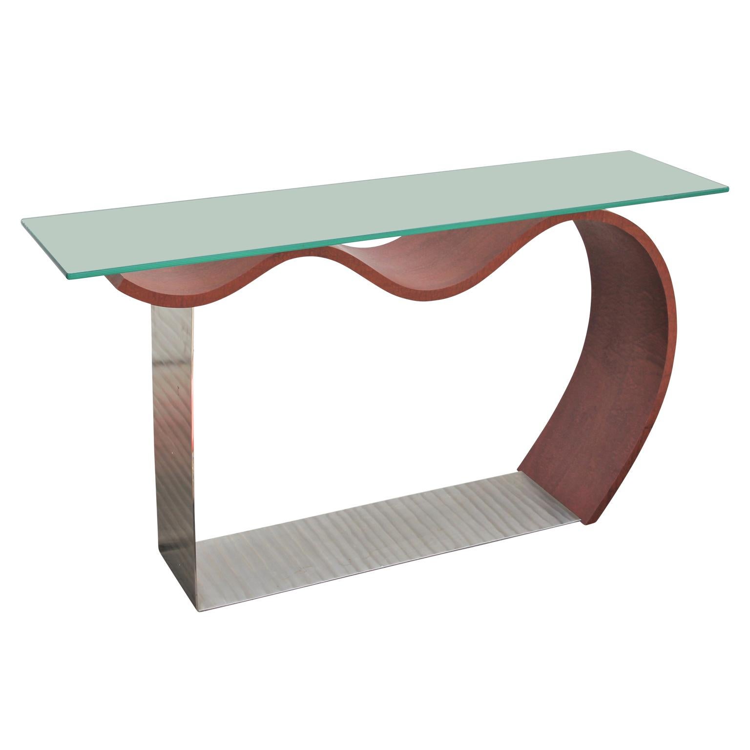 Fantastic quality and design, this console table features steamed bent wood, steel, and glass.

Richard Judd, born 1953 in Marshfield, WI. Attended the University of Wisconsin, Madison (1971-1973) and Milwaukee (B.S. in Architecture, 1975). Work