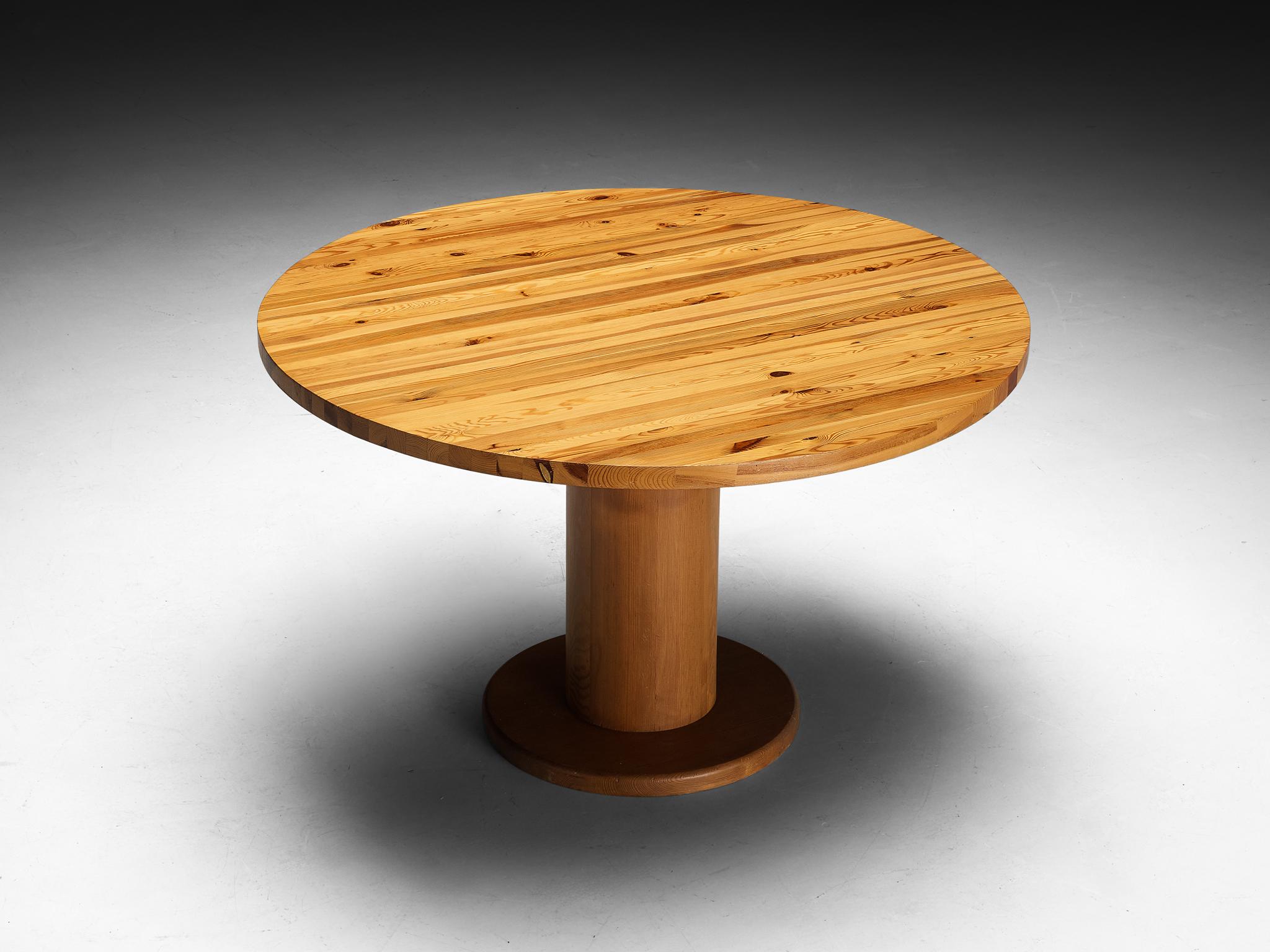 Dining or center table, pine, Europe, 1970s

This monumental dining table, crafted in Europe during the 1970s, is a striking piece of 20th century design. The round table top of this piece is made in an edge-grain type of way, solid wood strips are