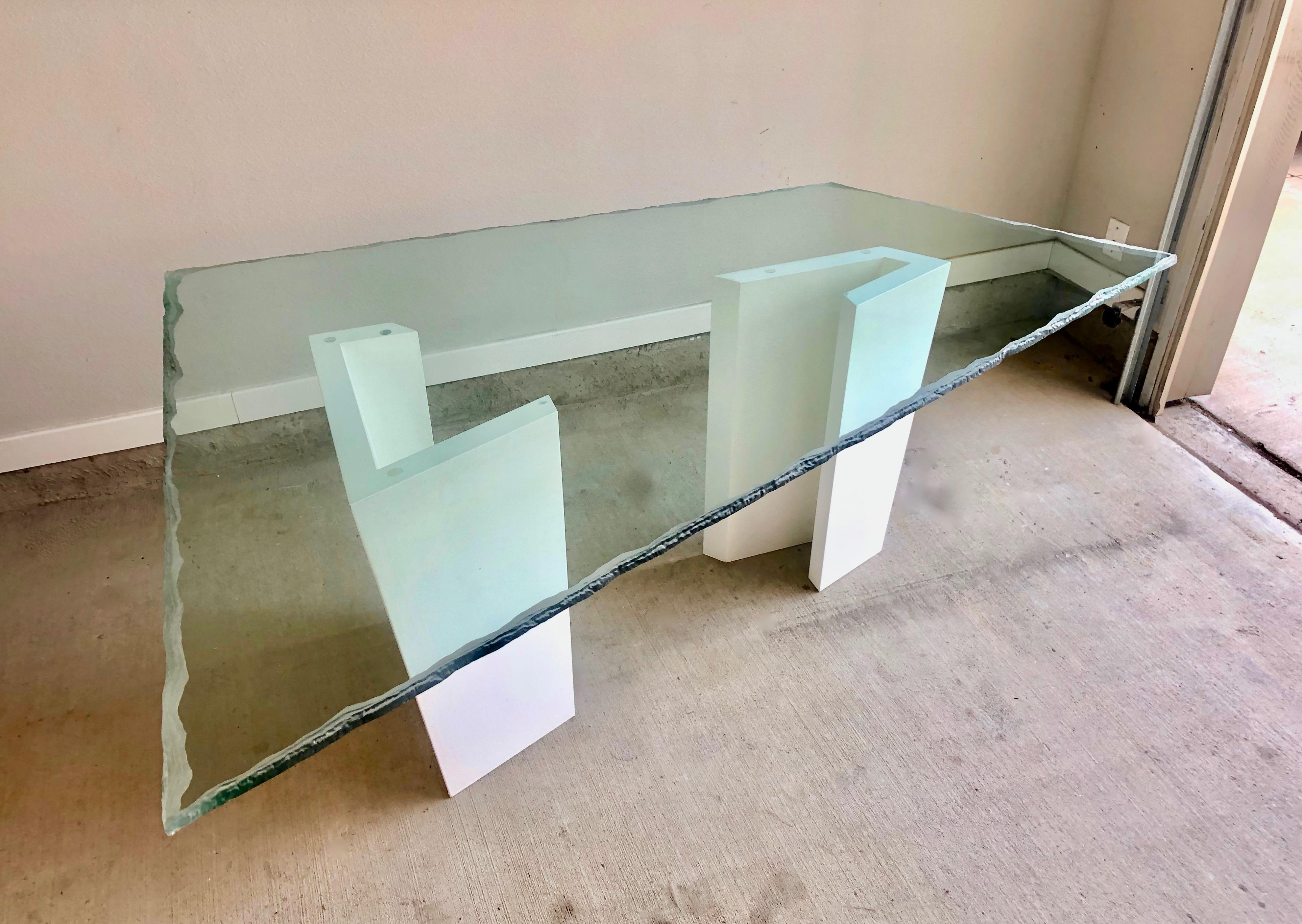 Post Modern Trapezium Sculpted Glass Top Dining Table On an abstract lacquered white wood base. This table can also be used as an executive desk.