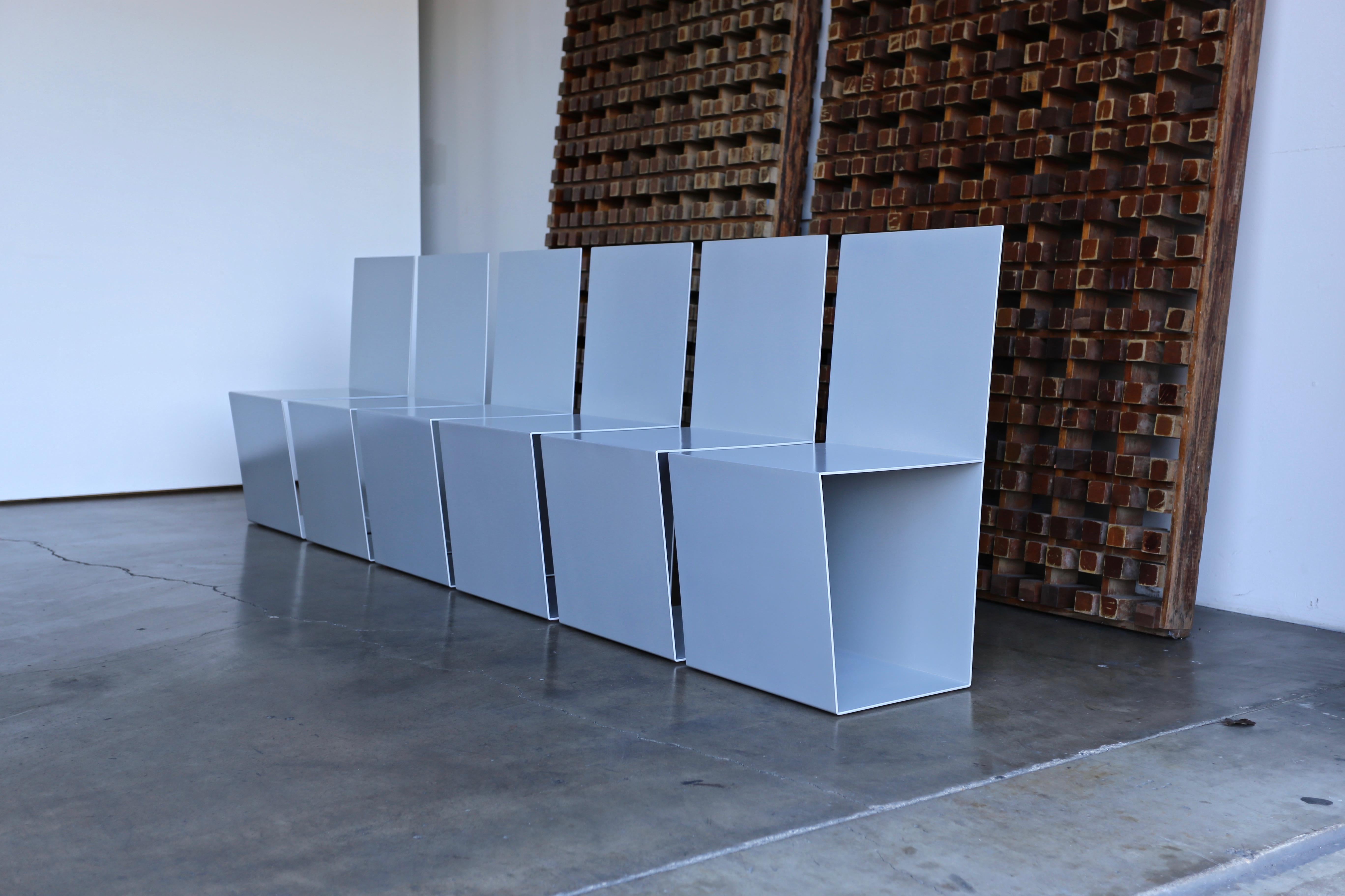 Set of six postmodern sculptural aluminium dining chairs, circa 1985. This set has been professionally restored.