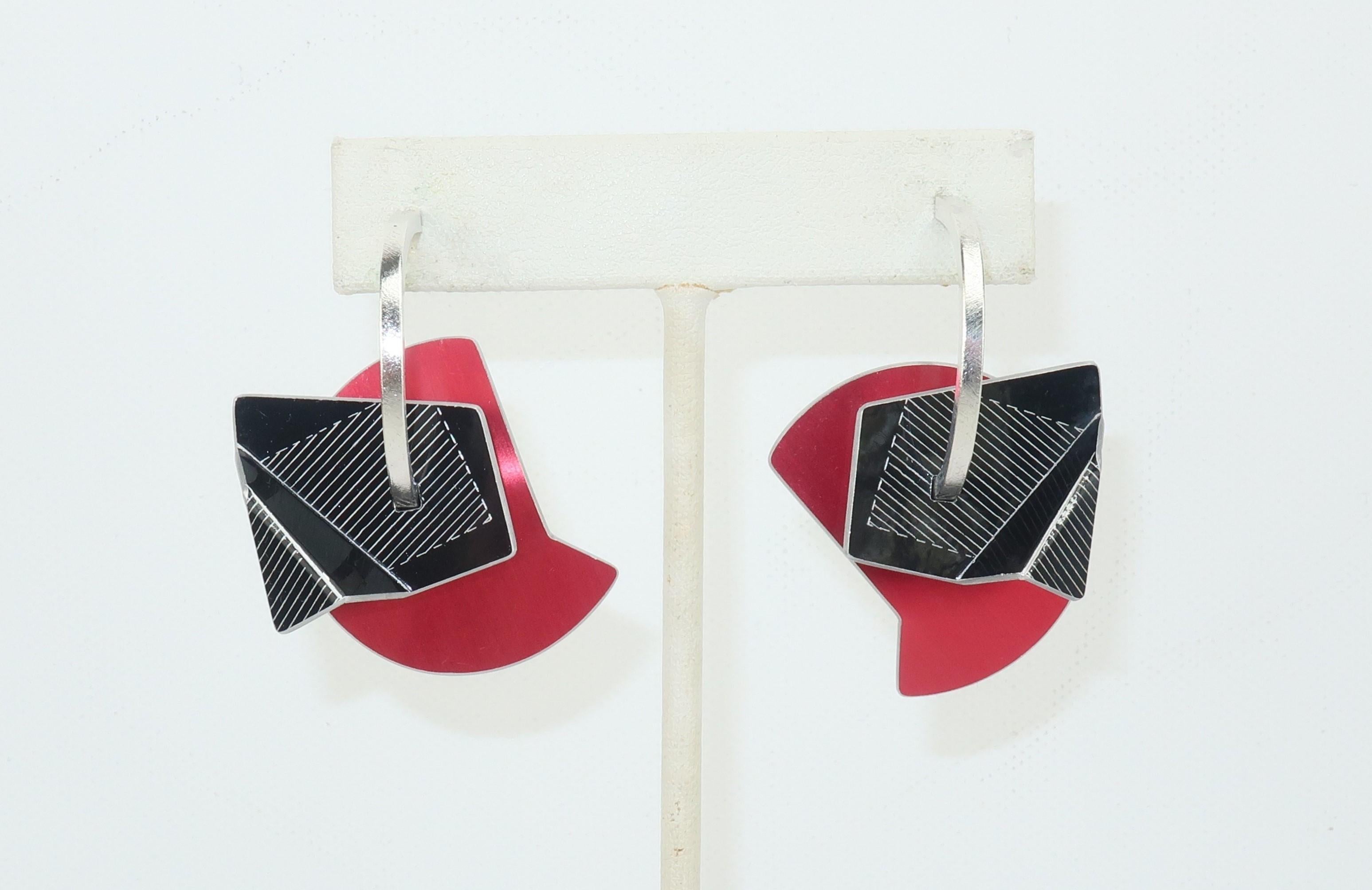 These post modern aluminum earrings are detailed pieces of wearable art with a definitive nod to 1930’s machine age industrial look.  Expertly angled and pieced together as four separate components including red and black anodized aluminum. 