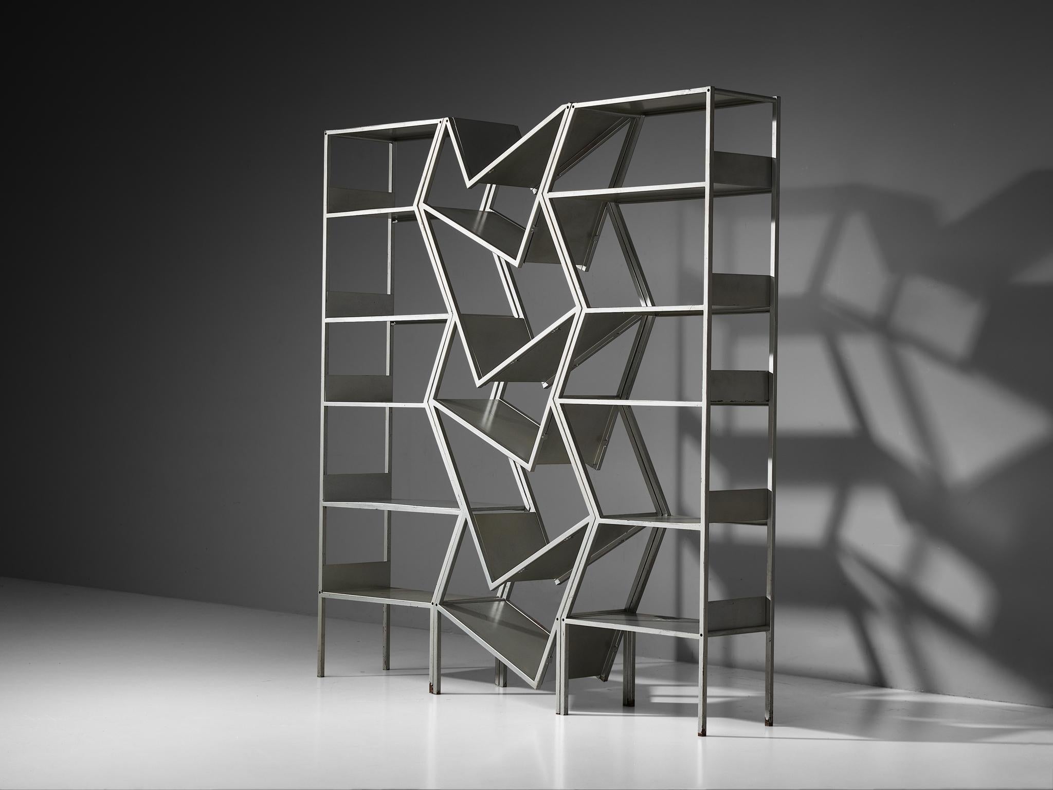 Storage unit or room divider, lacquered steel, Italy, 1970s

This captivating bookcase hails from Italy, a period marked by a break from traditional forms and a playful embrace of space and depth. Crafted from grey lacquered steel, the piece