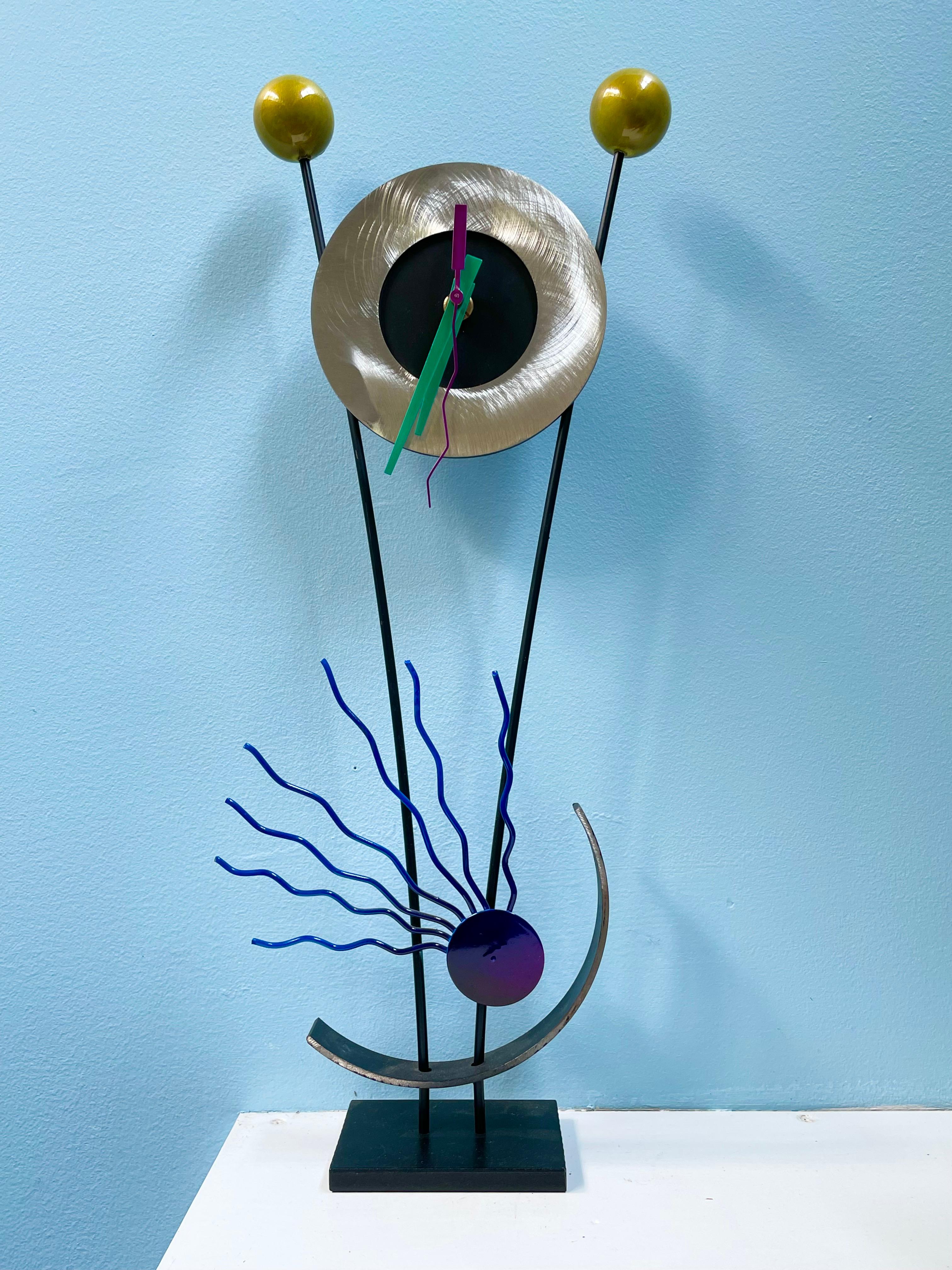 Really cool sculptural clock in the memphis style powered by a battery.