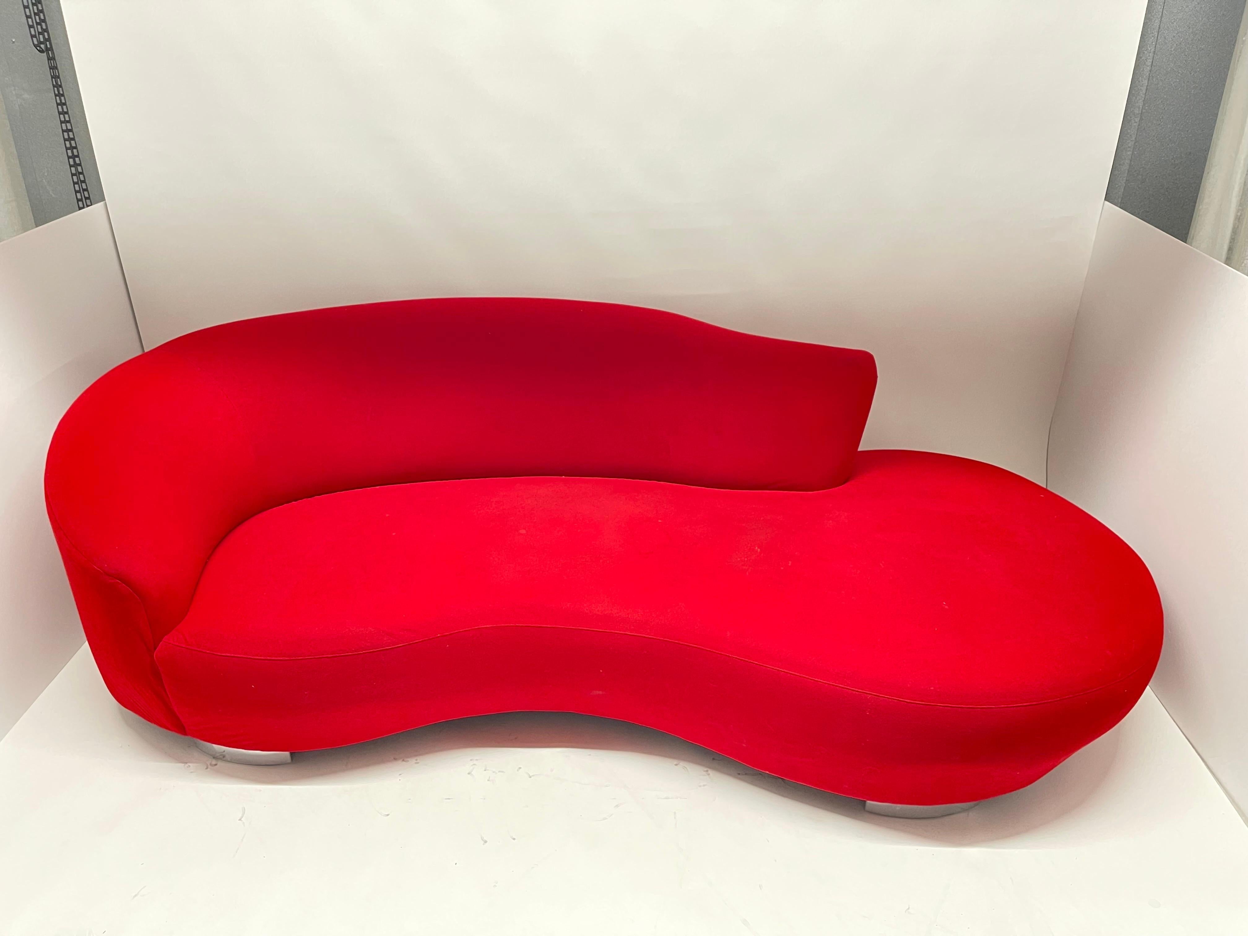 Original vintage Postmodern sculptural serpentine cloud curved chaise lounge sofa with right facing ottoman and left facing arm, rendered in original red microfiber ultra suede with chrome-plated steel feet for Weiman, USA, Circa 1990s.