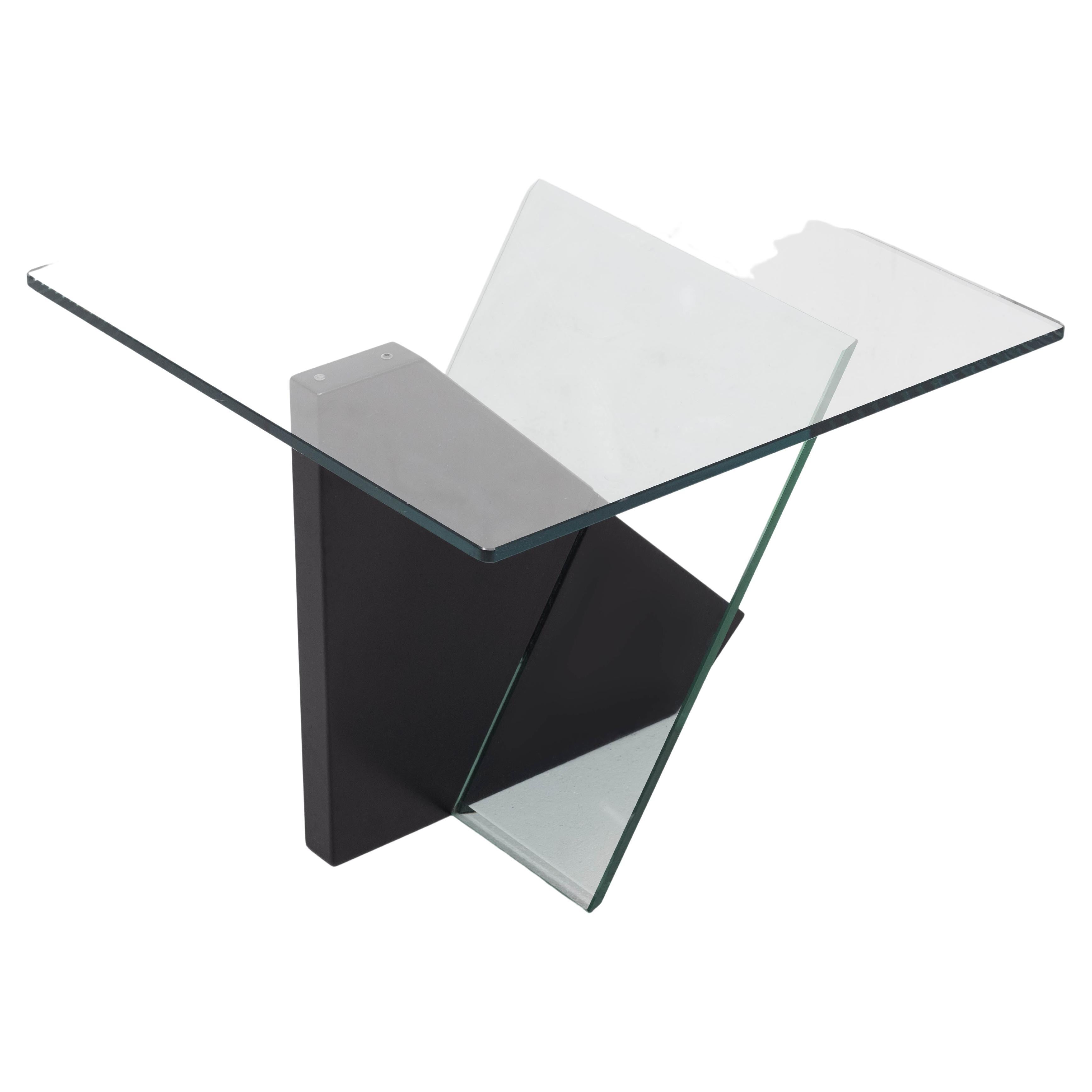 Very nice side table, two cut glass plates connecting by a thick wooden plate.
typical 1980s Post Modern in style.