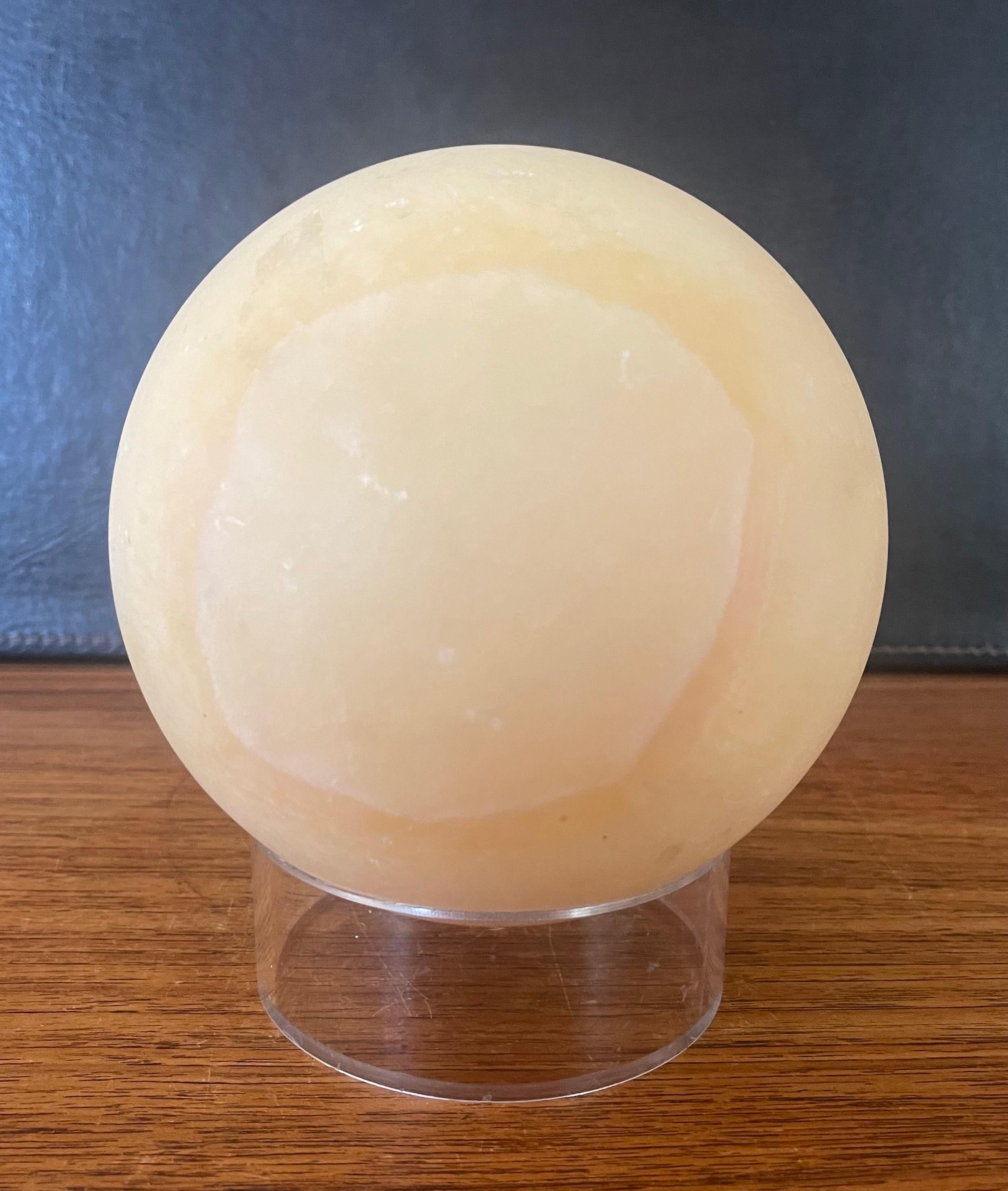Post-Modern Solid Travertine Sphere on Lucite Base In Good Condition For Sale In San Diego, CA