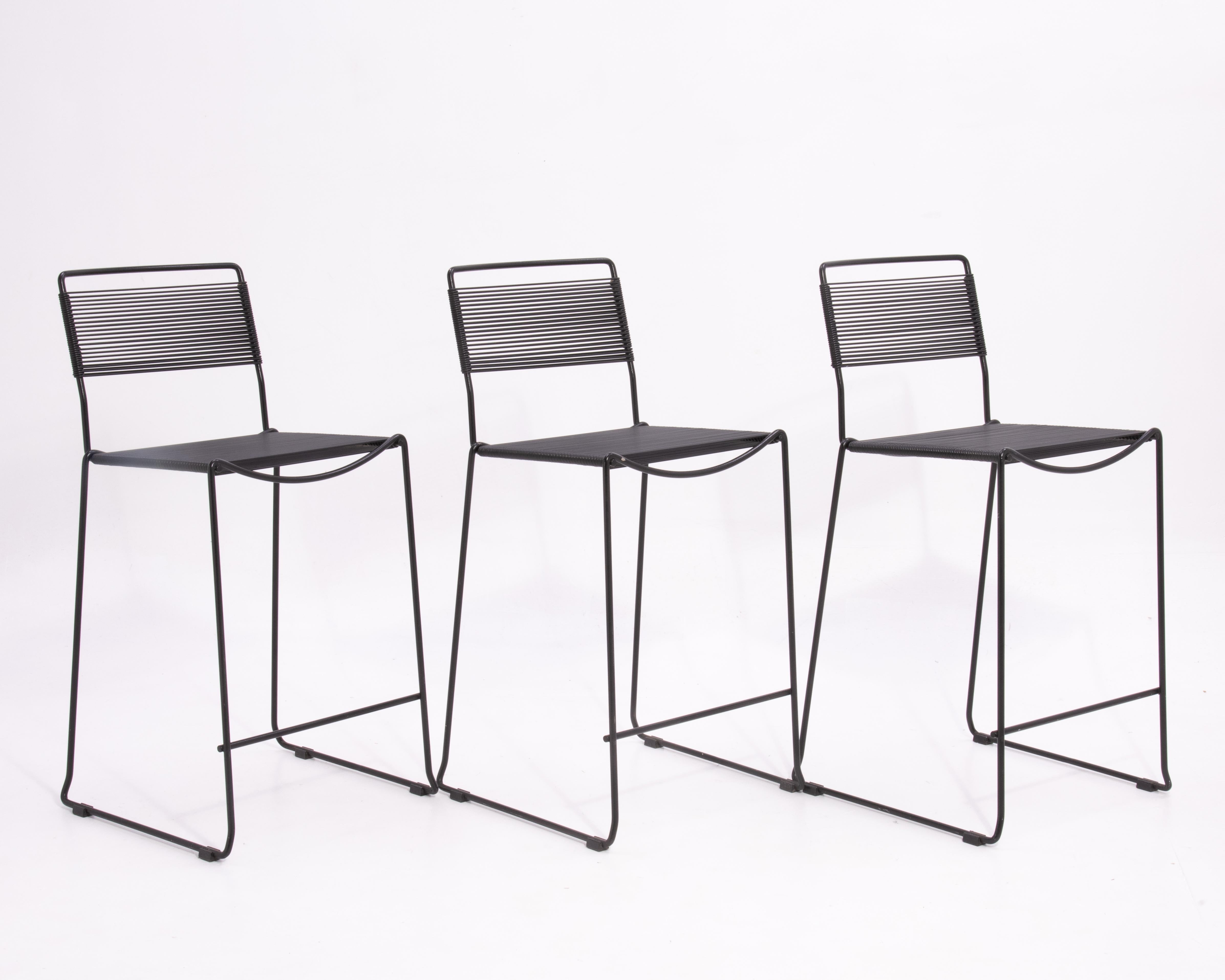 The spaghetti barstool designed by Giandomenico Belotti, unmarked, circa 1980s.
These stools have been attributed to Fly Line and Alias.
An iconic Post Modern design, the seats and backs are upholstered with 'spaghetti' straps made of strong PVC,