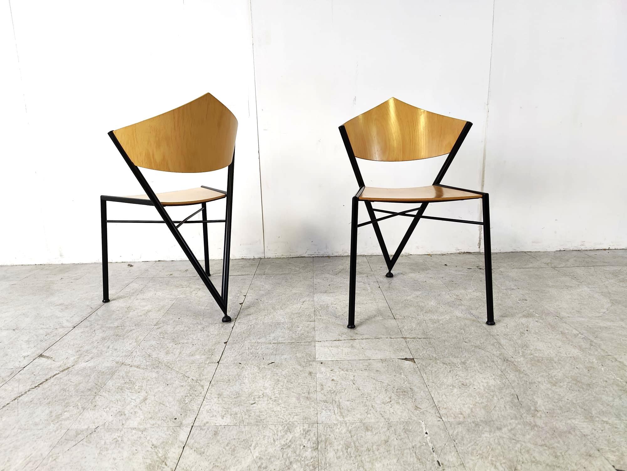 Geometrical post modern design dining chairs made from plywood and black metal.

The chairs are stackable, which is very handy.

Timeless design.

very good condition

1980s - Germany

Dimensions:
Height: 96cm
Width: 48cm
Depth: 43cm
Seat height: