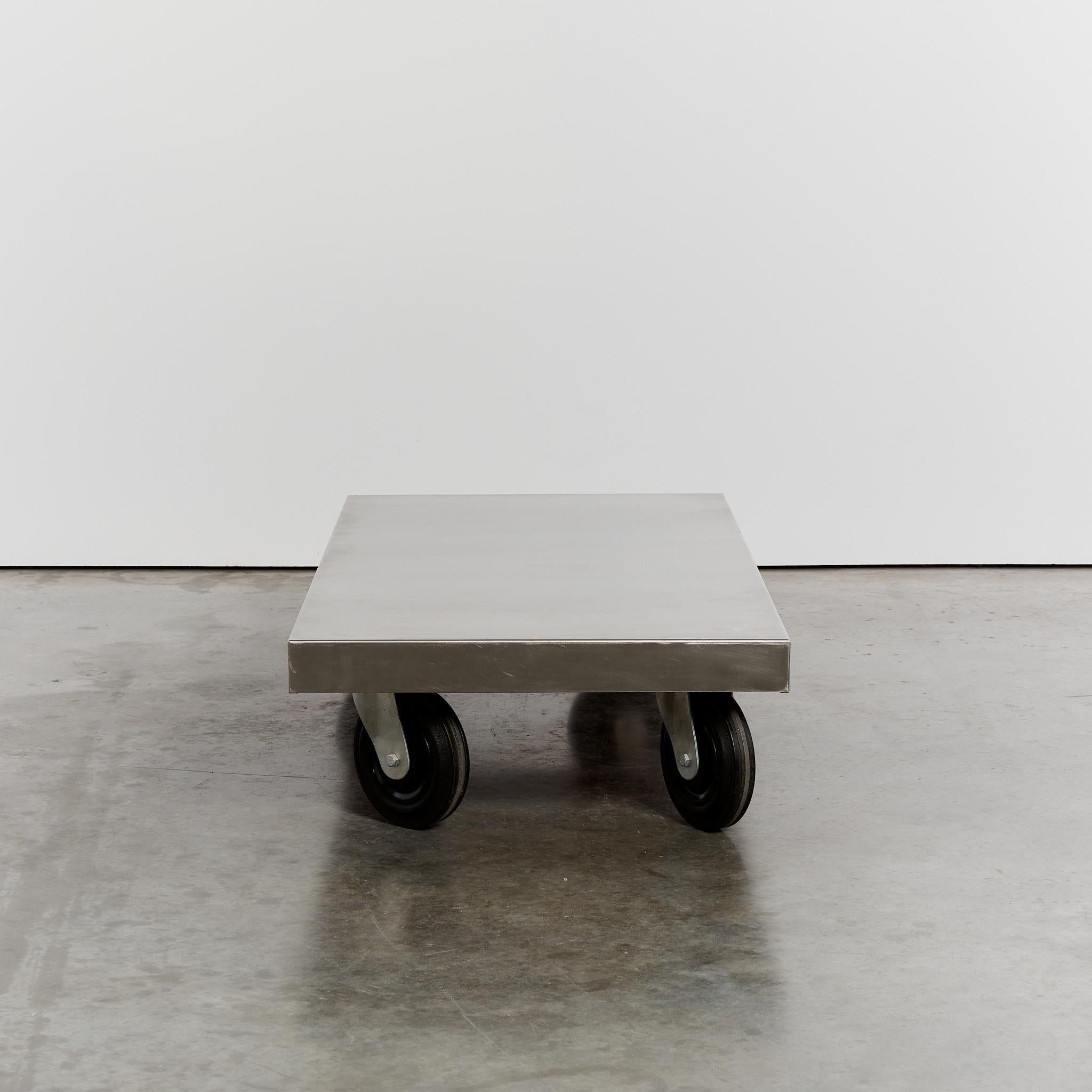 20th Century Post-modern stainless steel coffee table on castors For Sale