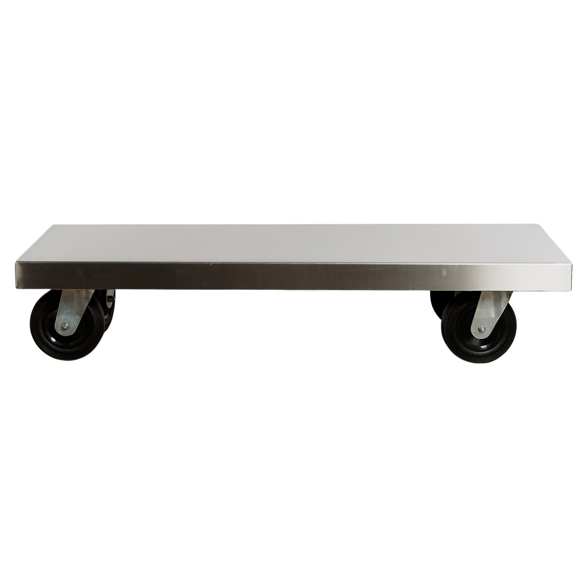 Post-modern stainless steel coffee table on castors For Sale